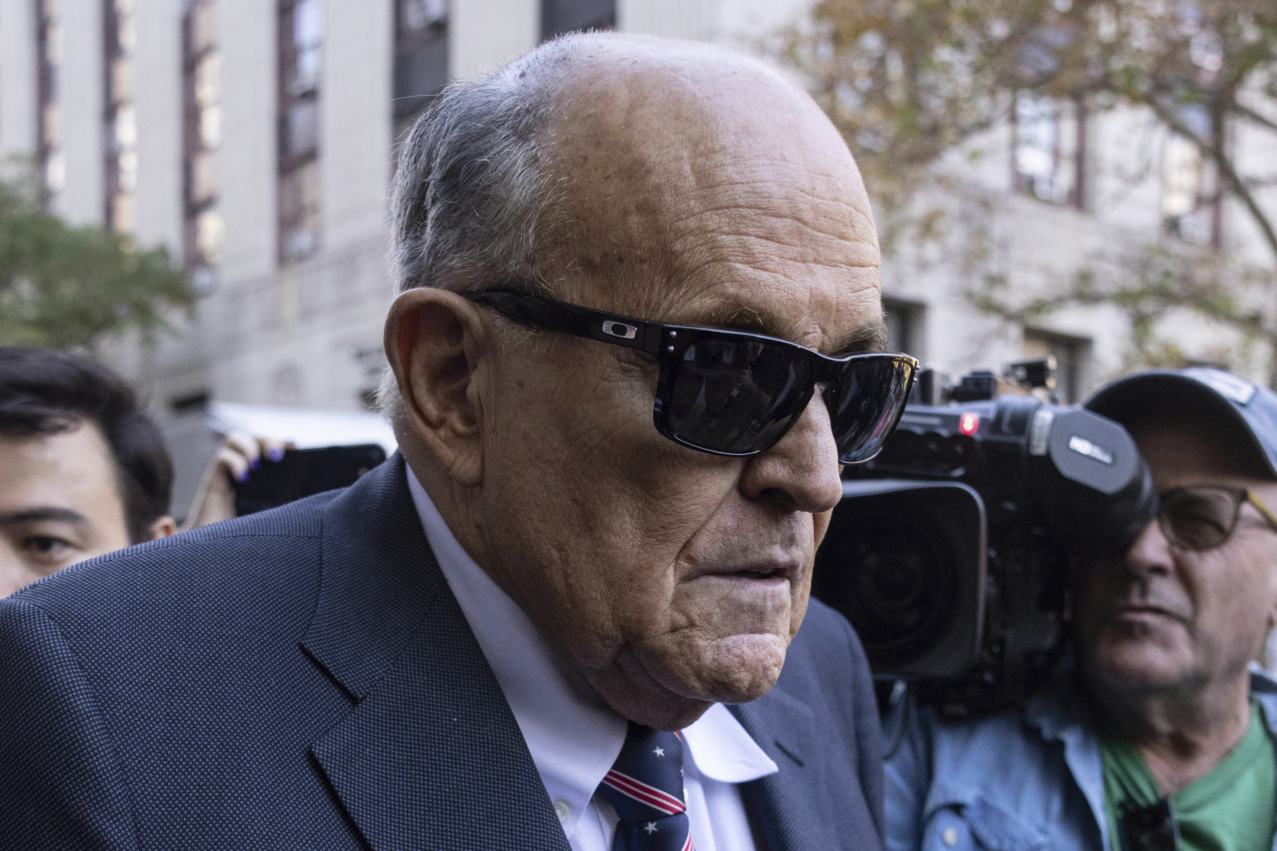 Former New York City Mayor Rudy Giuliani arrives at the court to explain to a federal judge why he hasn't surrendered his valuables as part of a $148 million defamation judgment, in New York, Thursday, Nov. 7, 2024. (AP Photo/Yuki Iwamura)