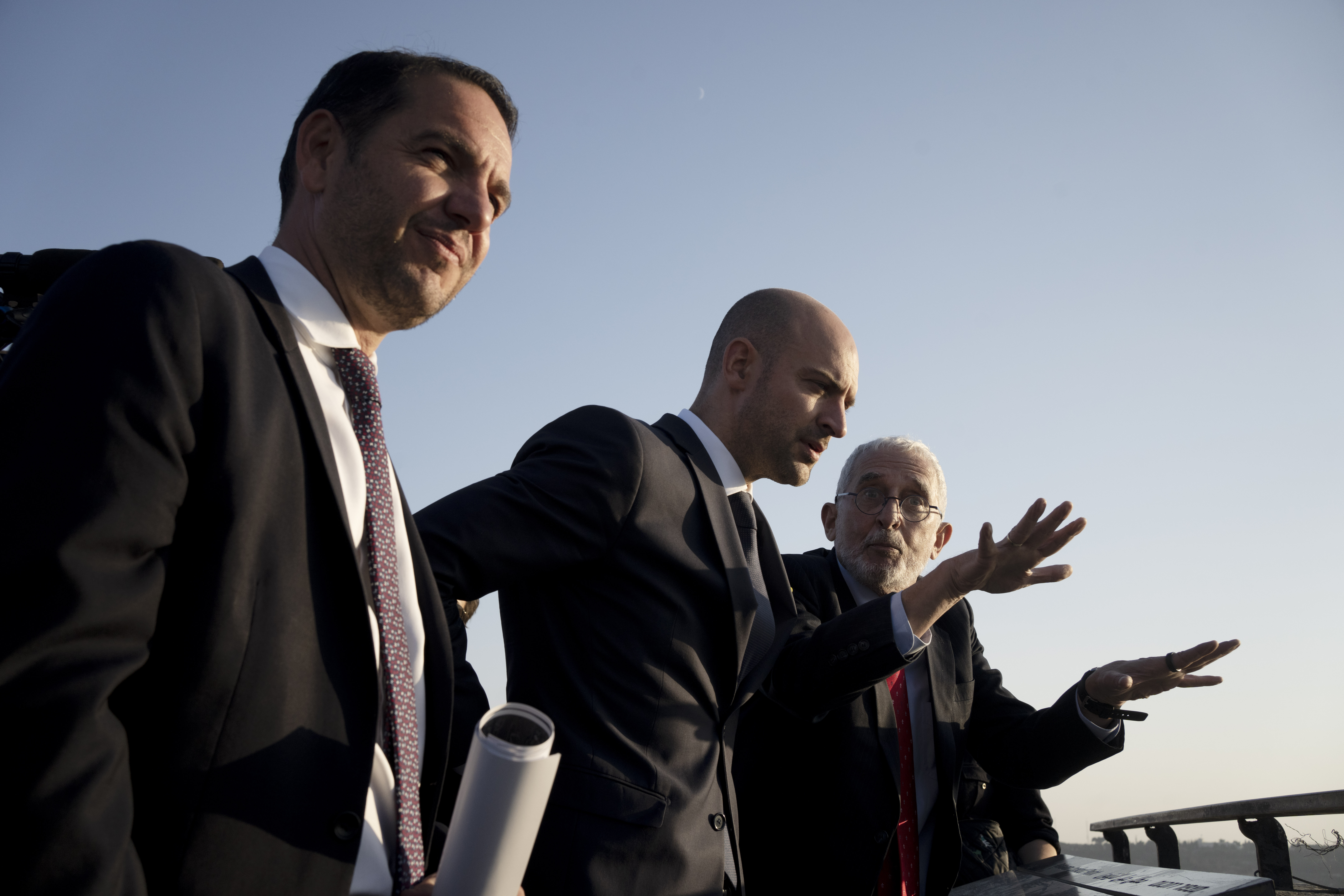 French Foreign Minister Jean-Noël Barrot, center, is briefed by Daniel Seidemann, right, overlooking the Old City of Jerusalem from the Mount of Olives during his visit to Jerusalem, Thursday, Nov. 7, 2024. (AP Photo/Maya Alleruzzo)