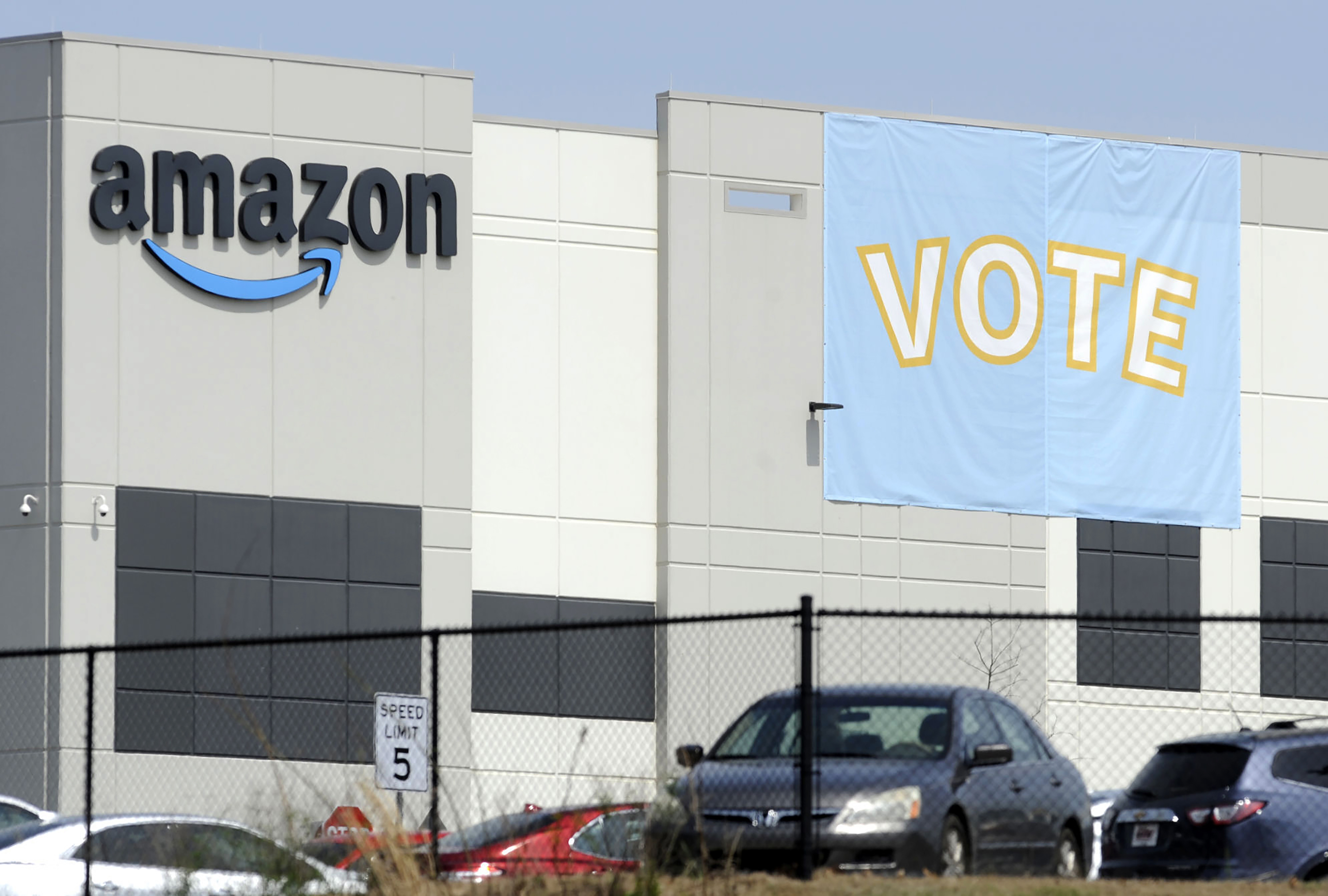 FILE - In this March 30, 2021 file photo, a banner encouraging workers to vote in labor balloting is shown at an Amazon warehouse in Bessemer, Ala. (AP Photo/Jay Reeves, File)