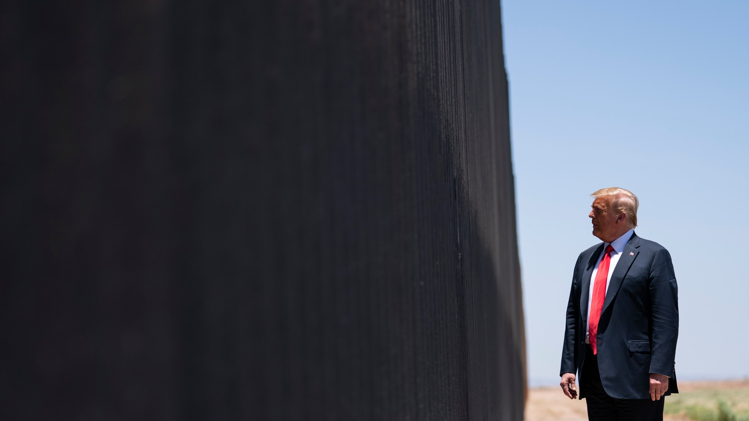 FILE - In this June 23, 2020, file photo, President Donald Trump tours a section of the border wall in San Luis, Ariz. (AP Photo/Evan Vucci, File)