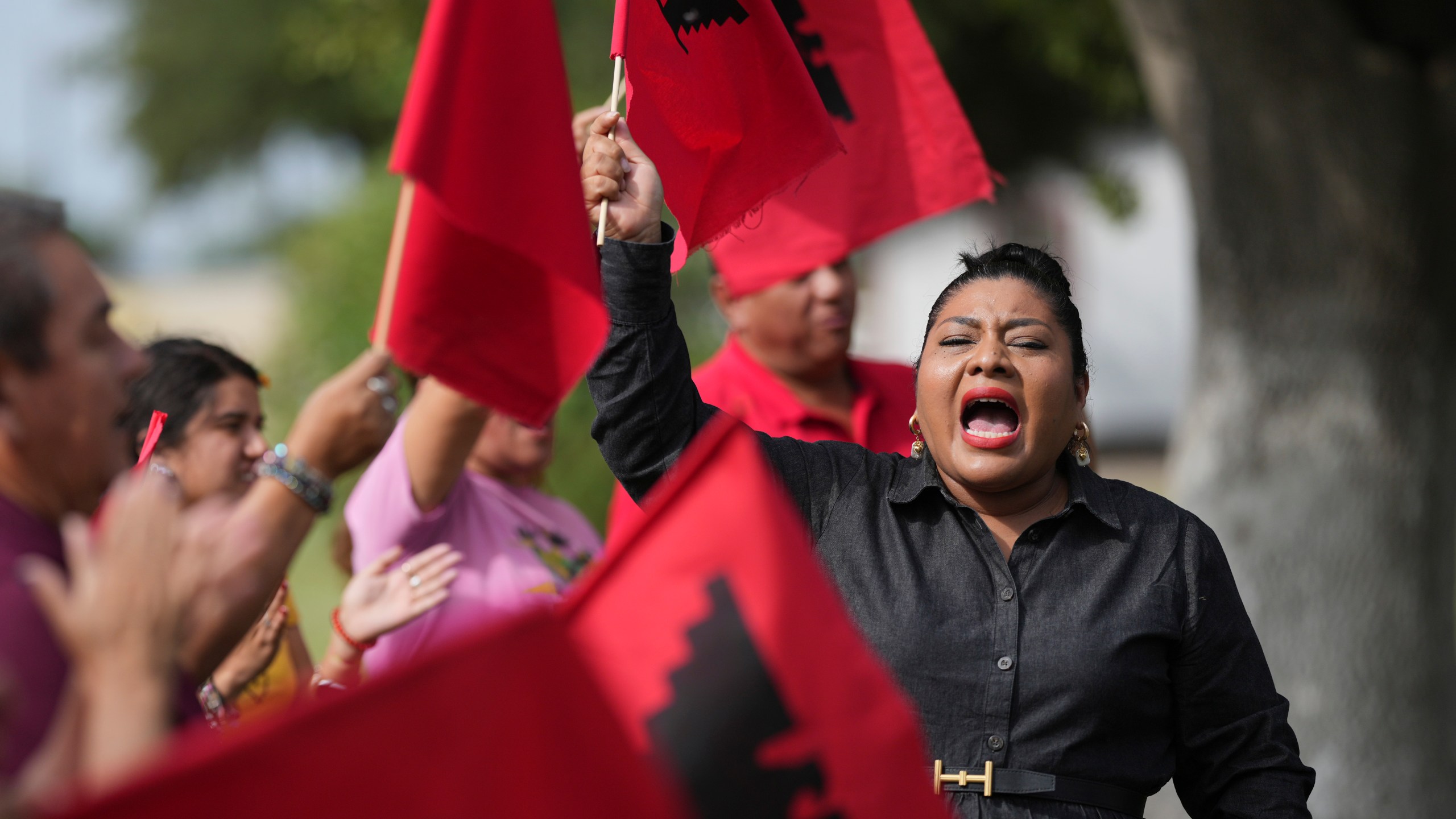 Tania Chavez, right, executive director of La Unión del Pueblo Entero (LUPE), leads members in a chant after making statements about yesterday's election, in San Juan, Texas, Wednesday, Nov. 6, 2024. (AP Photo/Eric Gay)