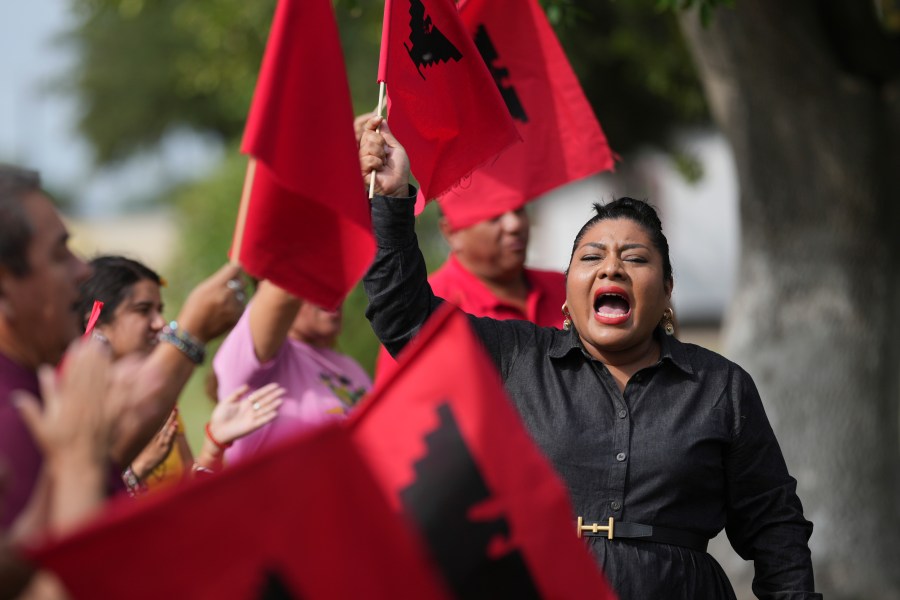 Tania Chavez, right, executive director of La Unión del Pueblo Entero (LUPE), leads members in a chant after making statements about yesterday's election, in San Juan, Texas, Wednesday, Nov. 6, 2024. (AP Photo/Eric Gay)