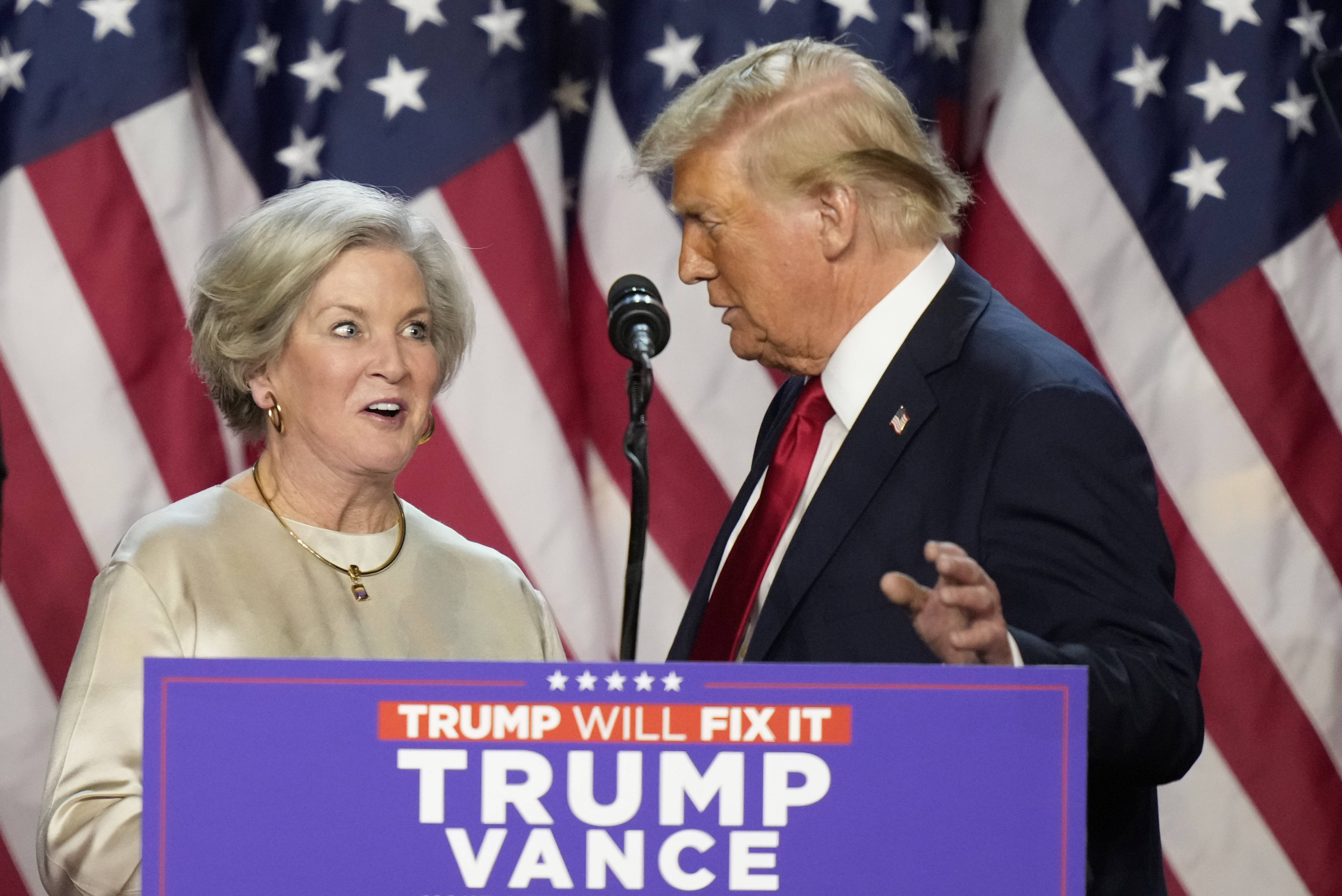 Republican presidential nominee former President Donald Trump brings Susie Wiles to the podium at an election night watch party Wednesday, Nov. 6, 2024, in West Palm Beach, Fla. (AP Photo/Alex Brandon)