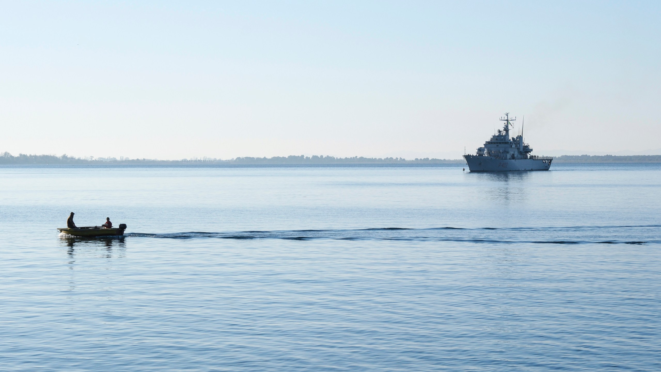 The Italian navy ship Libra approaches the port of Shengjin, northwestern Albania, Friday, Nov. 8, 2024, with the second group of eight migrants intercepted in international waters to be processed there in a reception facility despite the failure with the first group in October.(AP Photo/Vlasov Sulaj)