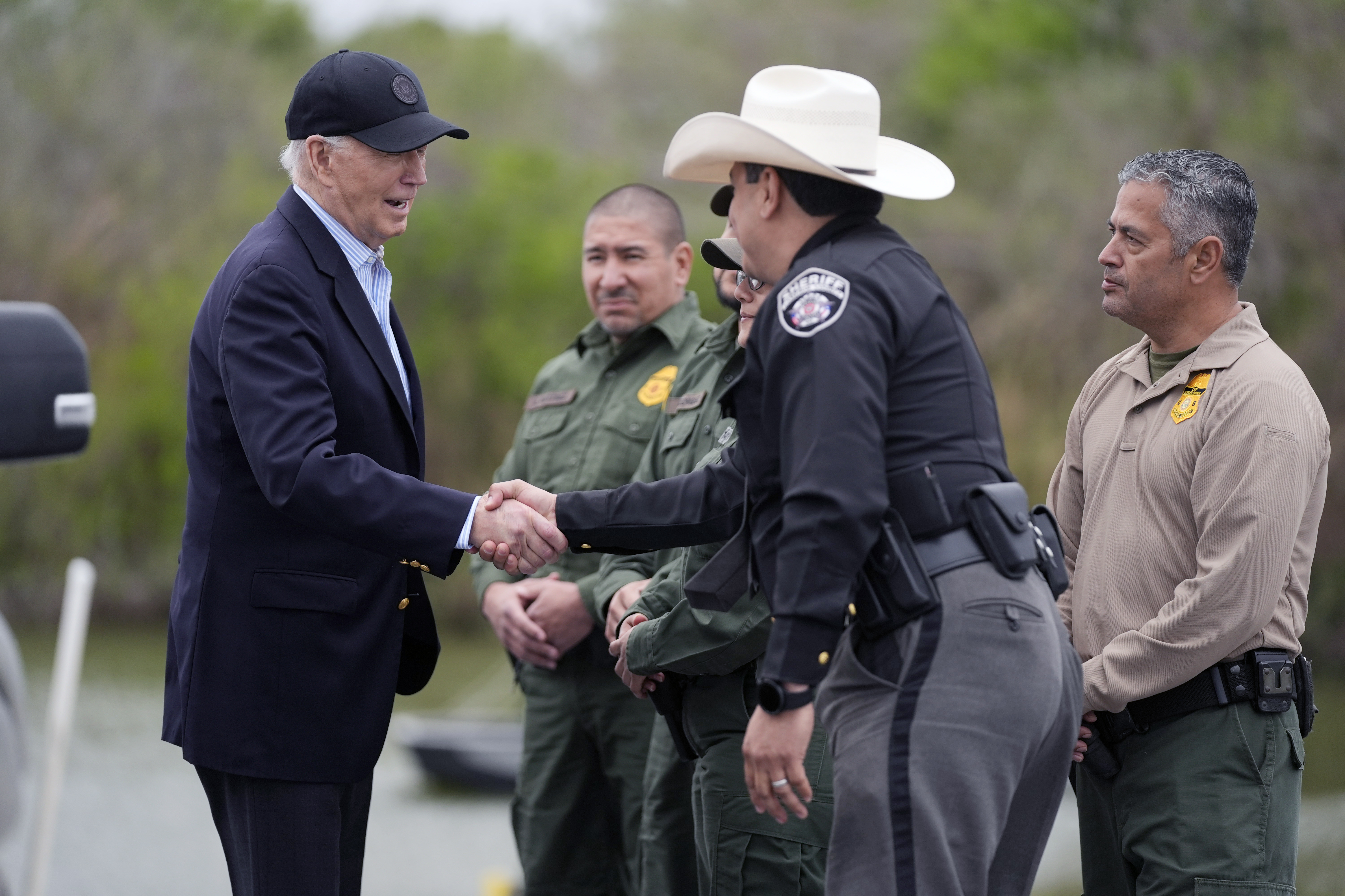 FILE - President Joe Biden talks with the U.S. Border Patrol and local officials, as he looks over the southern border, Feb. 29, 2024, in Brownsville, Texas, along the Rio Grande. (AP Photo/Evan Vucci, File)