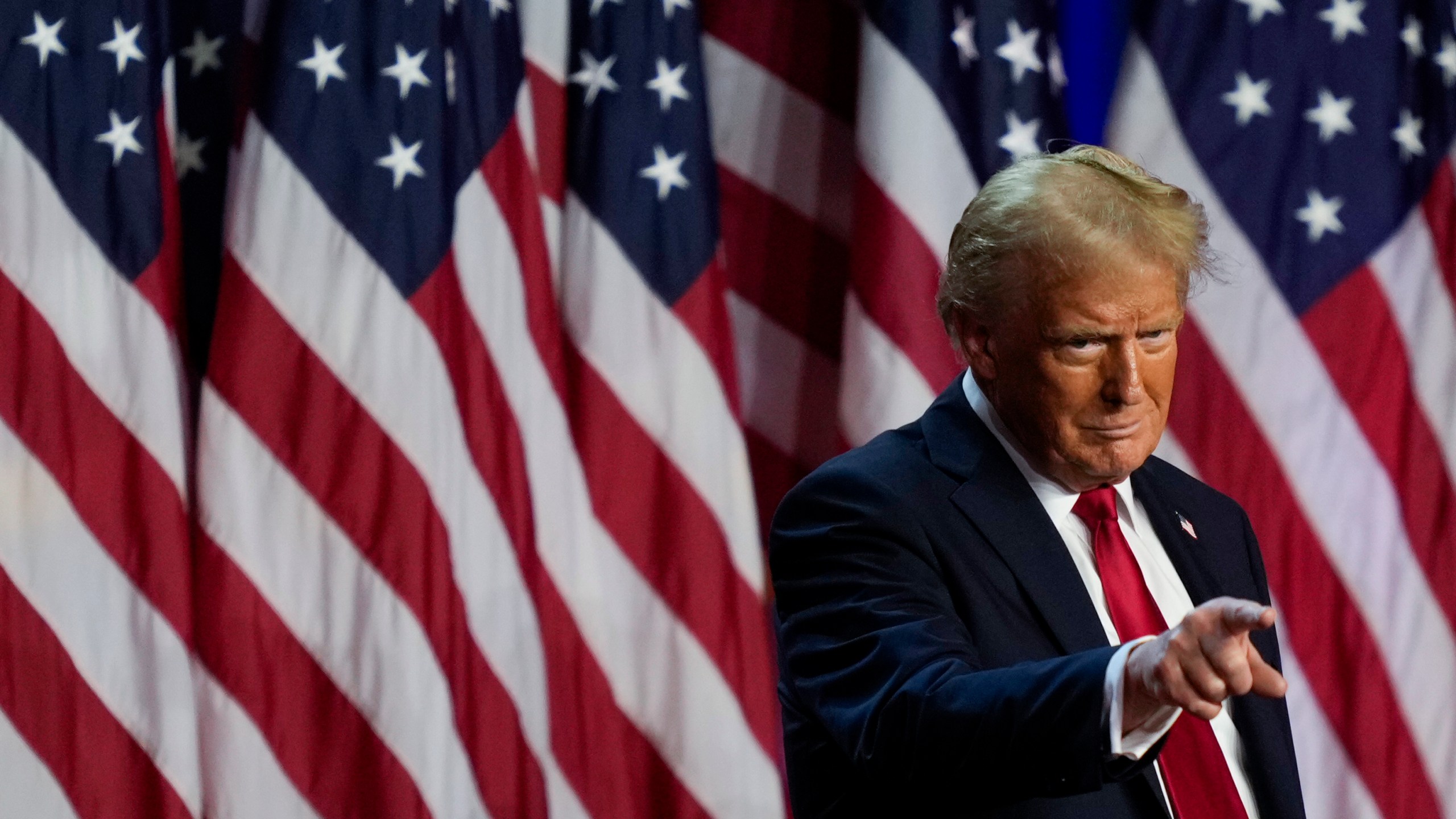 Republican presidential nominee former President Donald Trump points to the crowd at an election night watch party, Wednesday, Nov. 6, 2024, in West Palm Beach, Fla. (AP Photo/Julia Demaree Nikhinson)