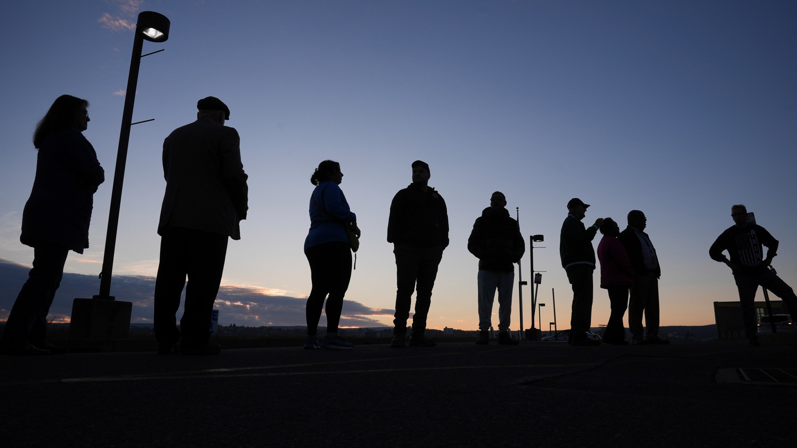 FILE - Voters wait in line to cast their ballots at Scranton High School in Scranton, Pa., on Election Day, Tuesday, Nov. 5, 2024. (AP Photo/Matt Rourke, File)