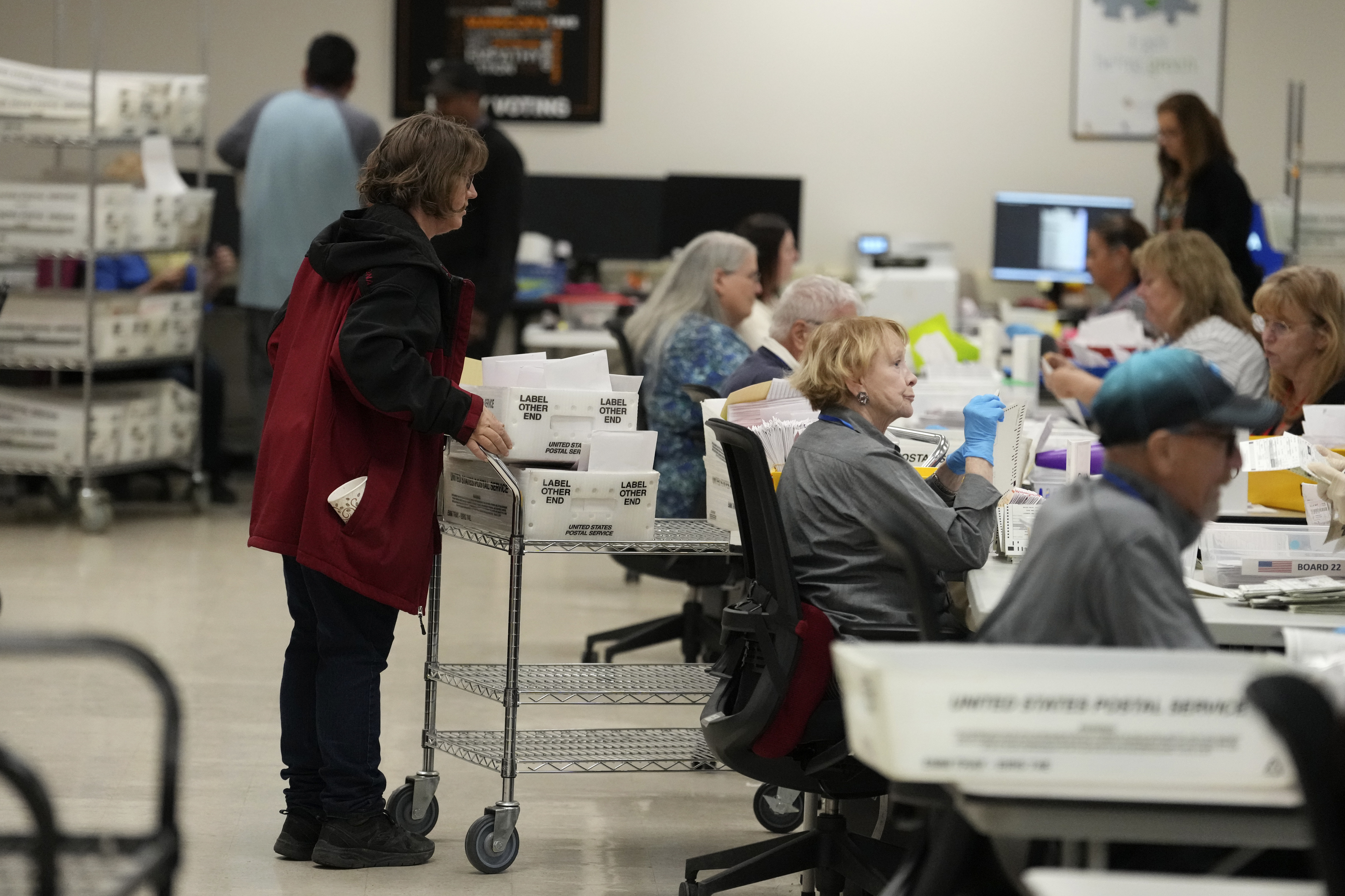 Election workers process ballots at the Maricopa County Tabulation Center Wednesday, Nov. 6, 2024, in Phoenix. (AP Photo/Ross D. Franklin)