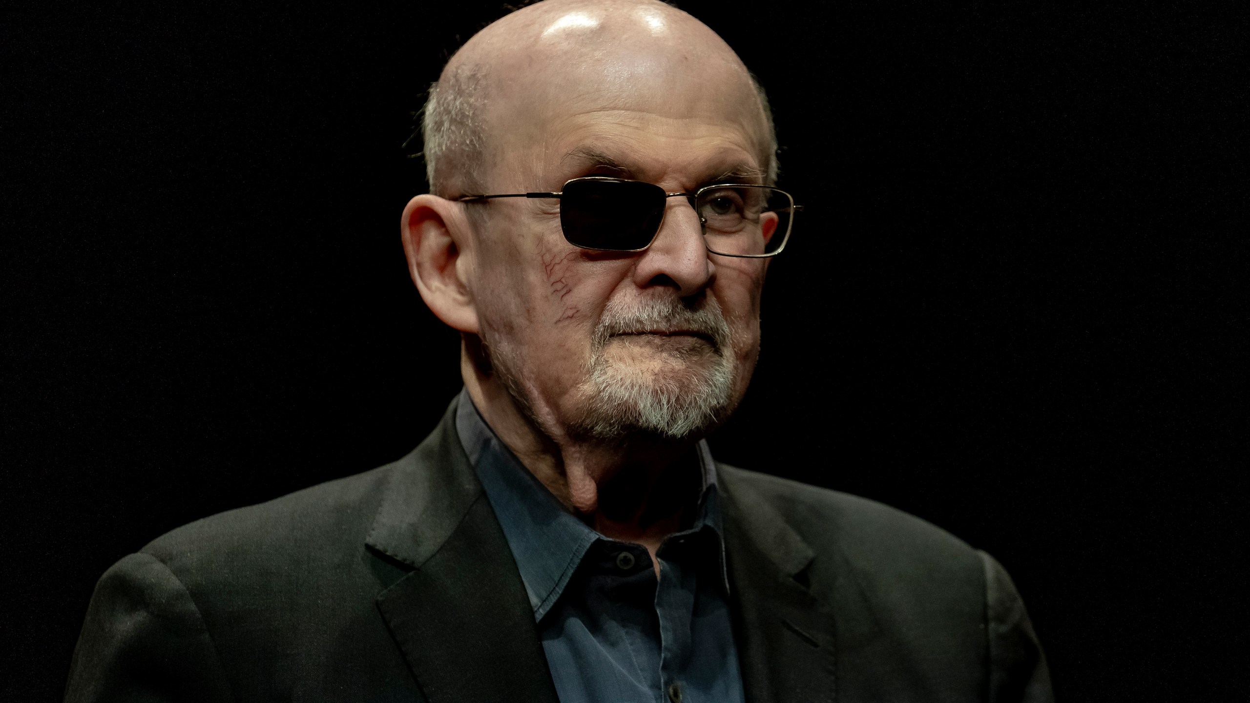 FILE - Salman Rushdie poses for a portrait to promote his book "Knife: Meditations After an Attempted Murder", at the Deutsches Theater in Berlin, Germany, Thursday, May 16, 2024. (AP Photo/Ebrahim Noroozi, File)