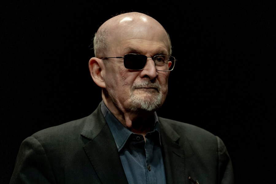 FILE - Salman Rushdie poses for a portrait to promote his book "Knife: Meditations After an Attempted Murder", at the Deutsches Theater in Berlin, Germany, Thursday, May 16, 2024. (AP Photo/Ebrahim Noroozi, File)