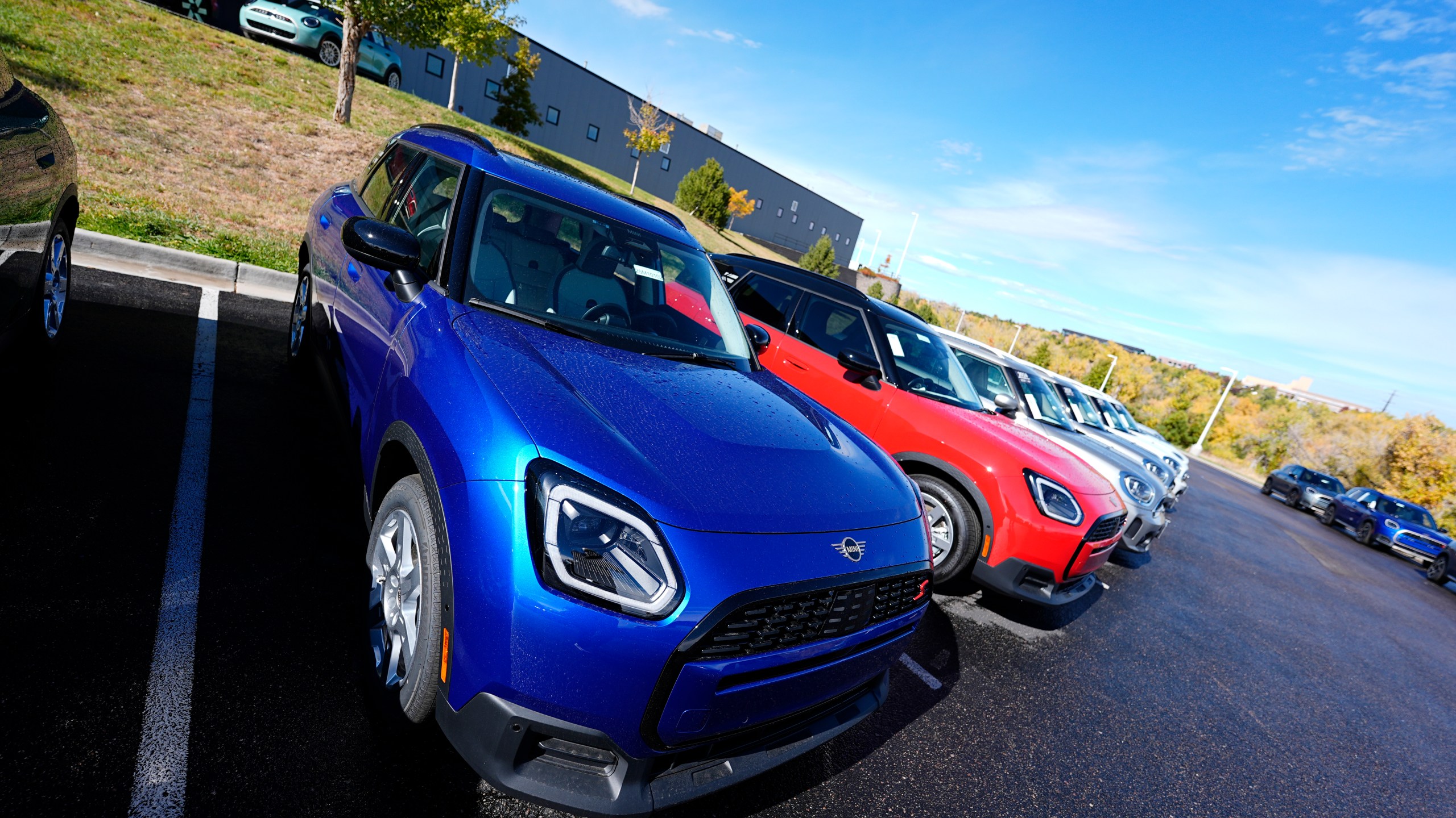 FILE - Unsold 2025 Countryman sports-utility vehicles sit on display at a Mini dealership on Oct. 21, 2024, in Highlands Ranch, Colo. (AP Photo/David Zalubowski, File)