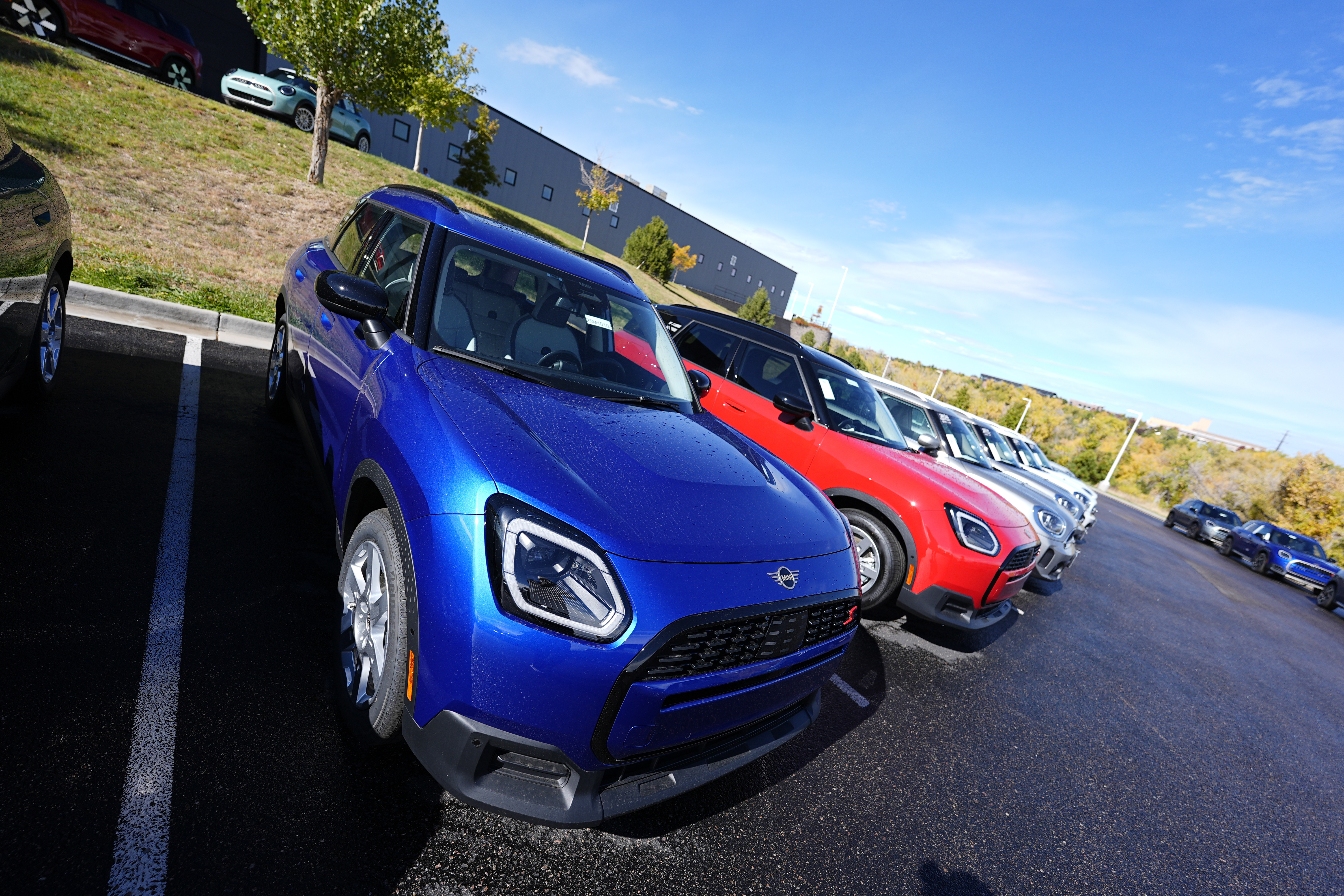 FILE - Unsold 2025 Countryman sports-utility vehicles sit on display at a Mini dealership on Oct. 21, 2024, in Highlands Ranch, Colo. (AP Photo/David Zalubowski, File)