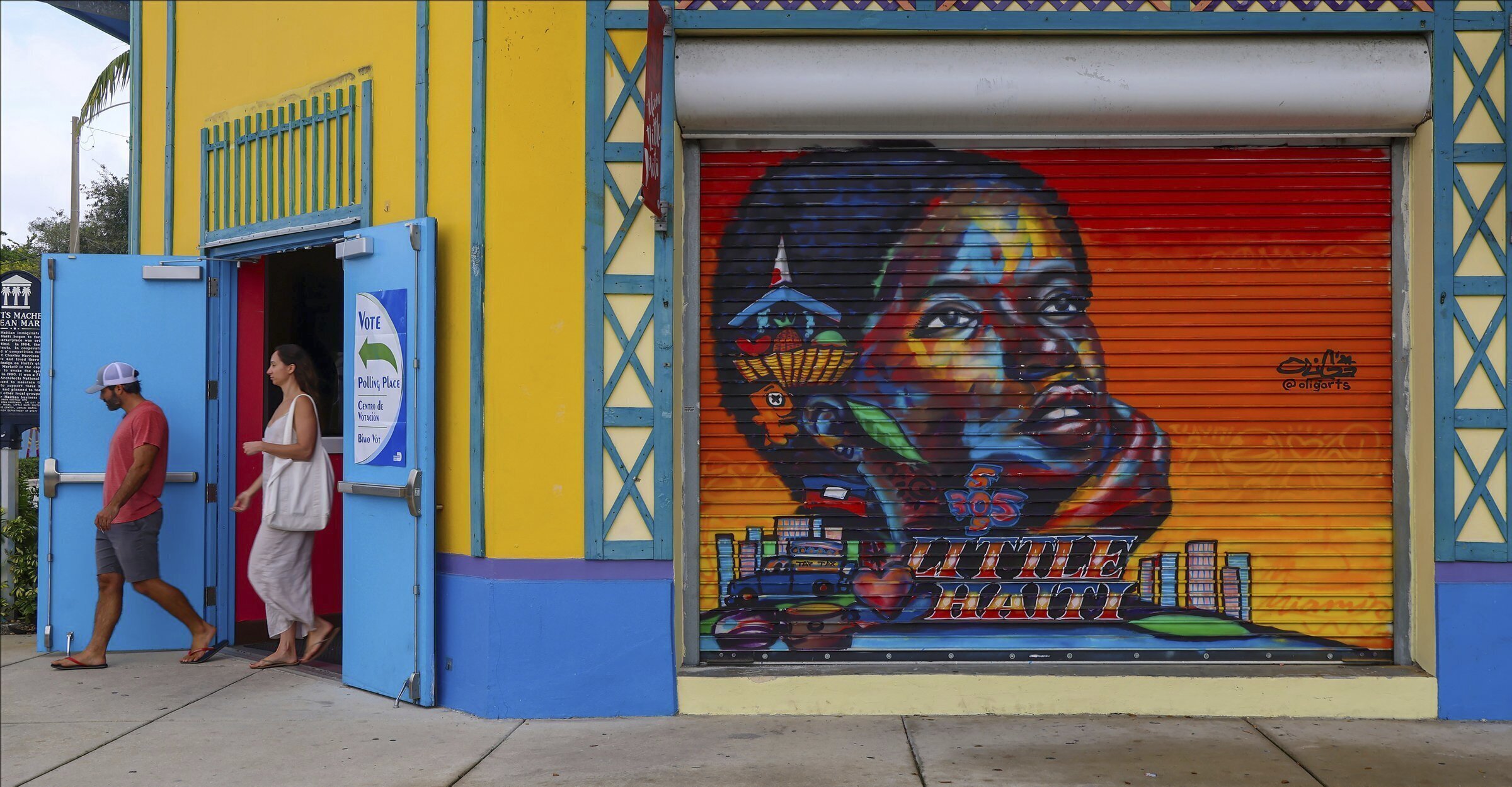 A voter exits the polling station on Election Day at the Little Haiti Cultural Complex's Caribbean Marketplace in Miami's Little Haiti neighborhood Tuesday, Nov. 5, 2024. (Carl Juste//Miami Herald via AP)