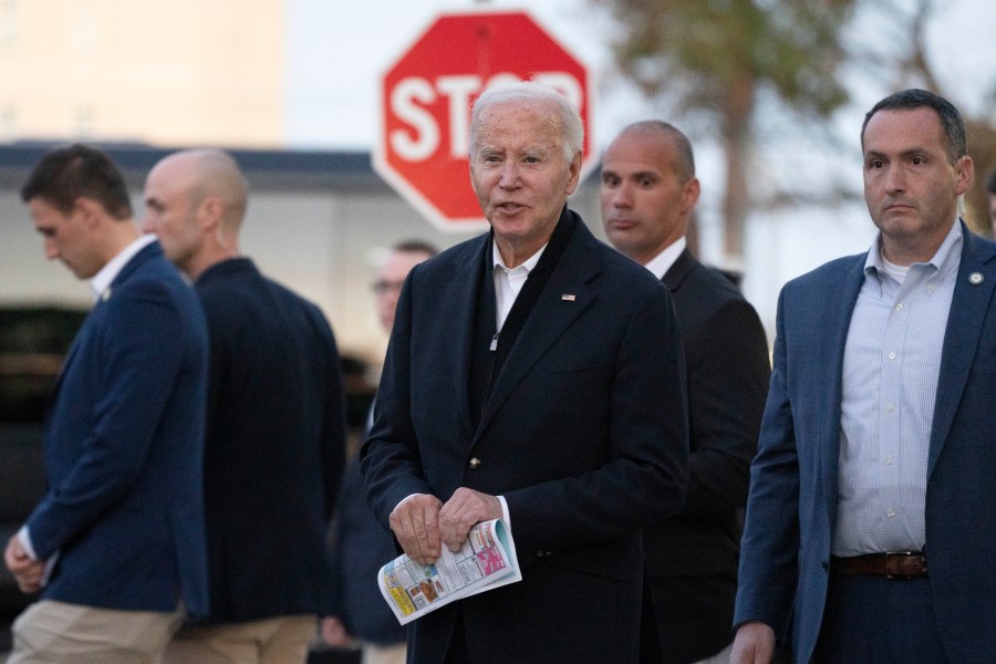 President Joe Biden responds to reporters' questions as he leaves St. Edmond Roman Catholic Church in Rehoboth Beach, Del., after attending mass, Saturday, Nov. 9, 2024. (AP Photo/Manuel Balce Ceneta)