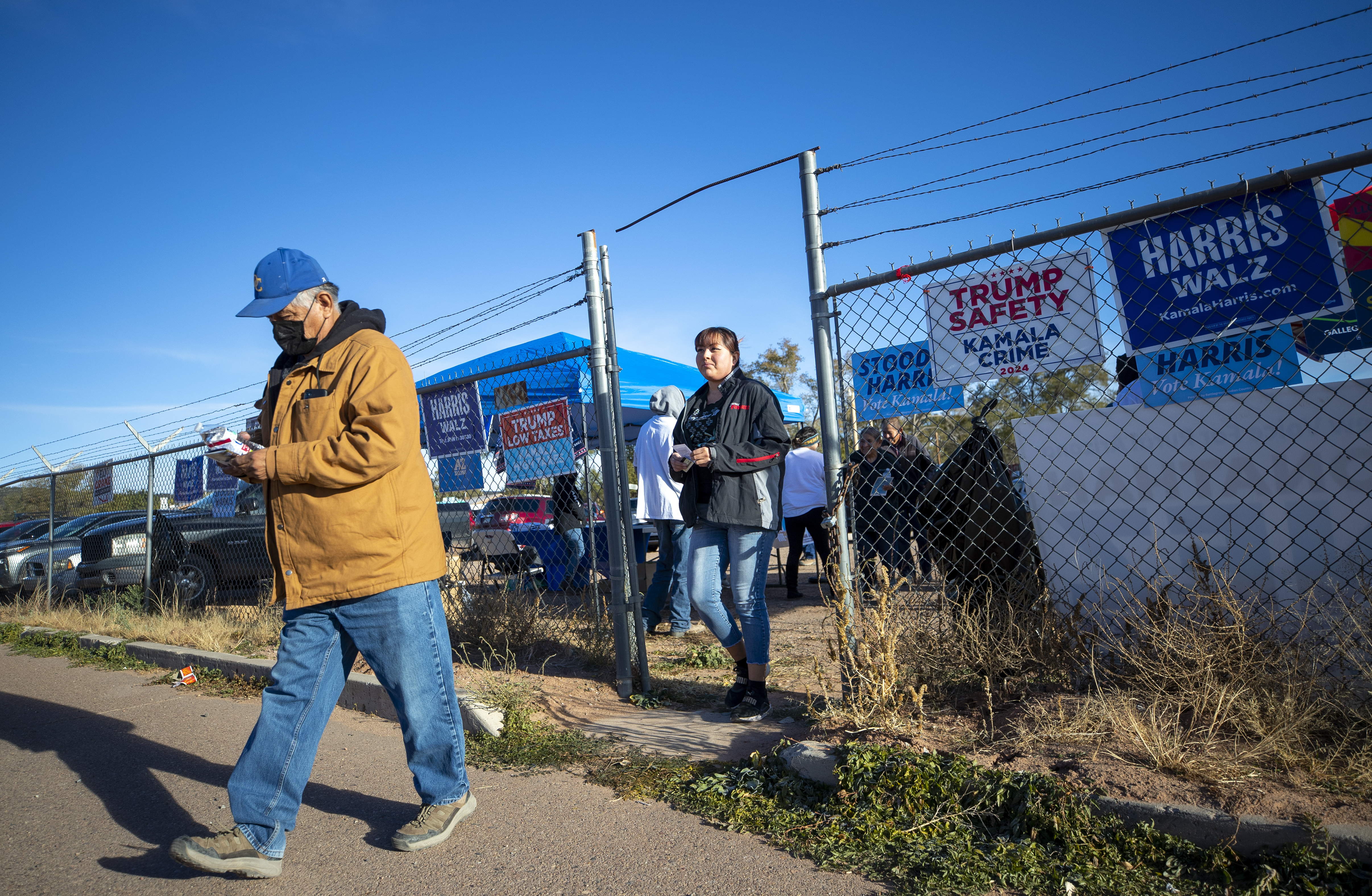 Voters arrive to a polling station on the Navajo Nation in Fort Defiance, Ariz., on Election Day, Tuesday, Nov. 5, 2024. (AP Photo/Andres Leighton)