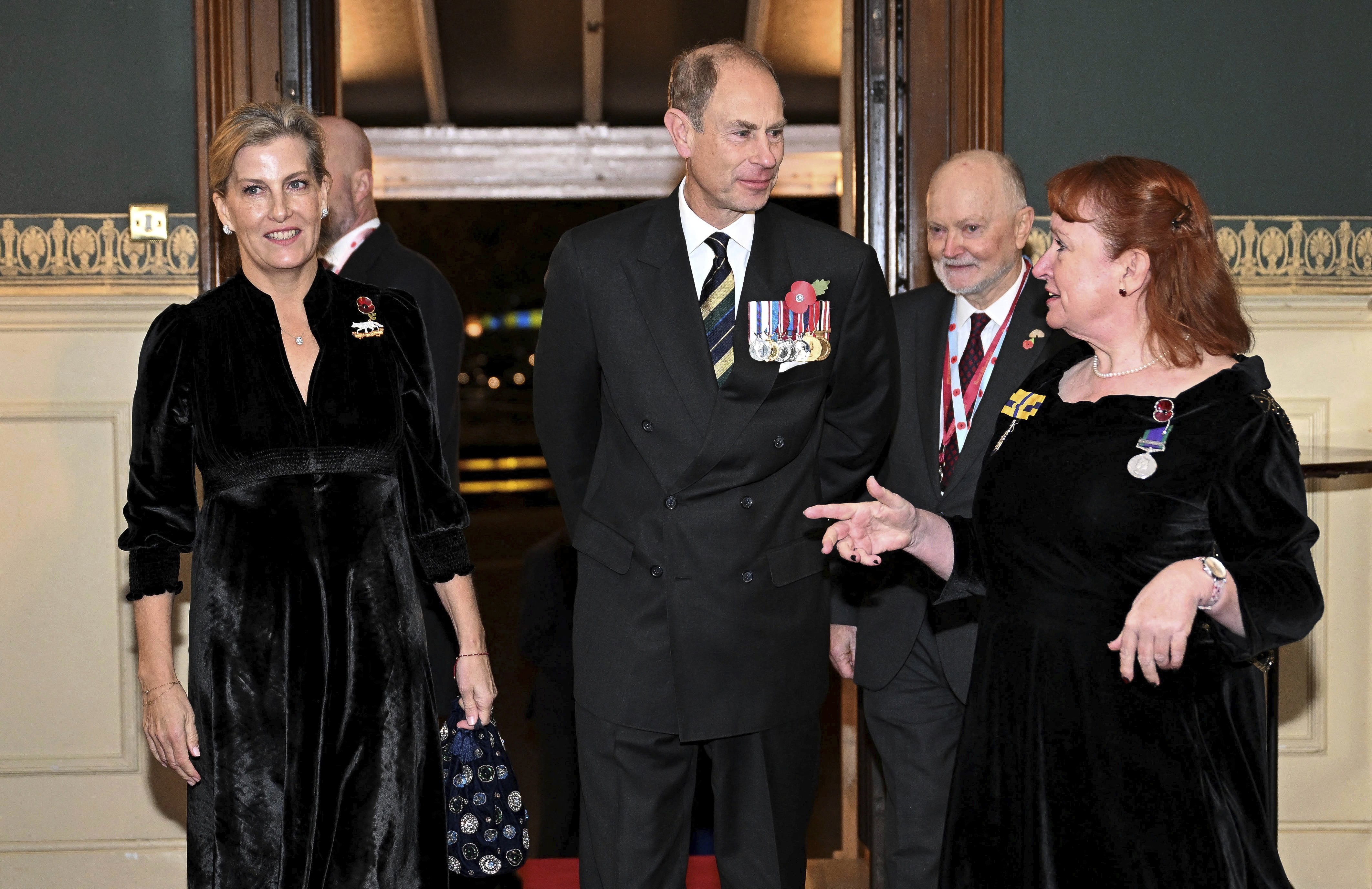 Prince Edward, Duke of Edinburgh, center, and Sophie, Duchess of Edinburgh, left, attend the Royal British Legion Festival of Remembrance at the Royal Albert Hall in London, Saturday Nov. 9, 2024. (Chris J. Ratcliffe/Pool Photo via AP)