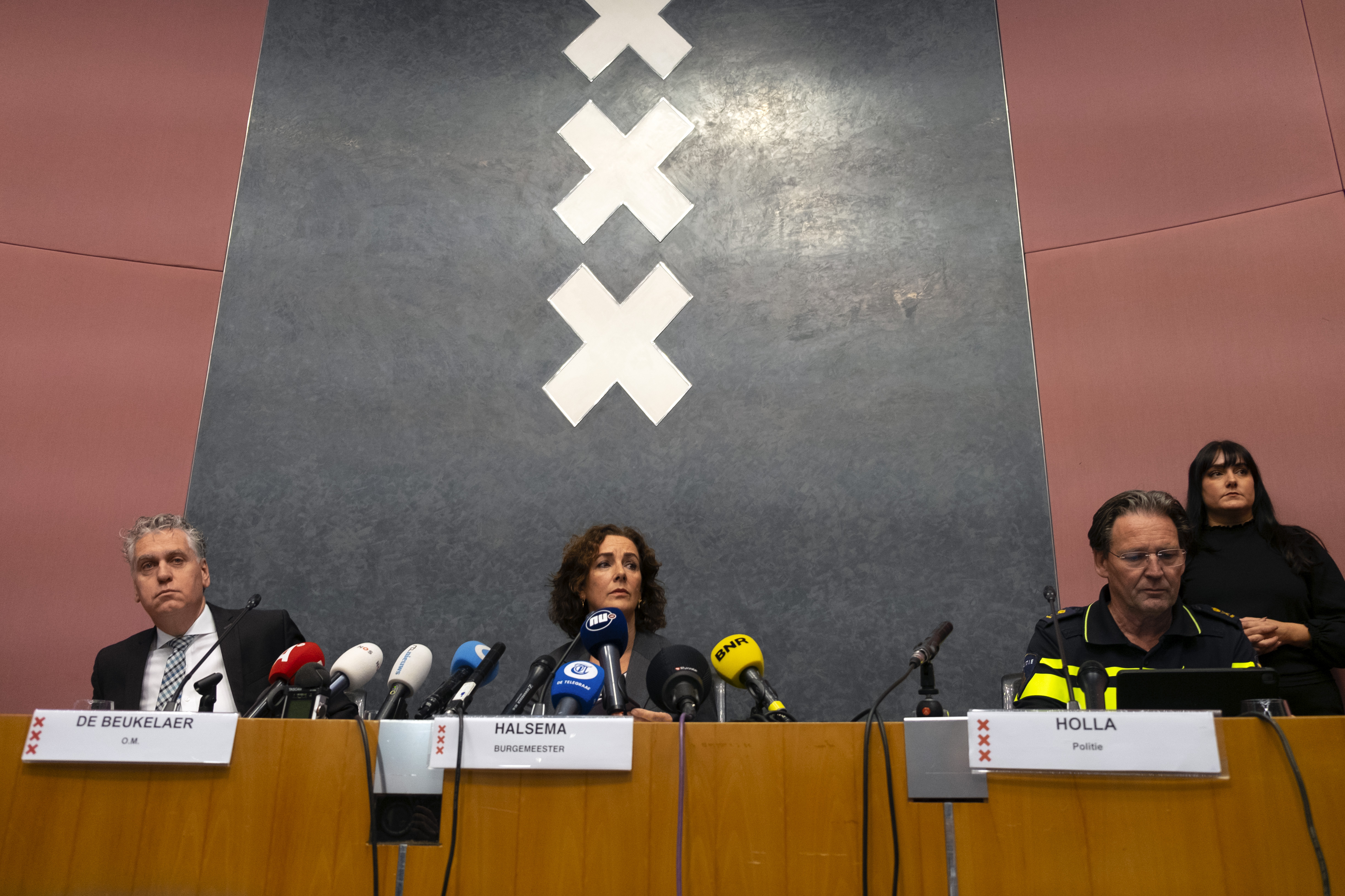 Amsterdam's Mayor Femke Halsema, centre, acting Amsterdam police chief Peter Holla, left, and head of the Amsterdam public prosecutor's office René de Beukelaer hold a news conference after Israeli fans and protesters clashed overnight after a soccer match, in Amsterdam, Netherlands, Friday Nov, 8, 2024. (AP Photo/Mike Corder)