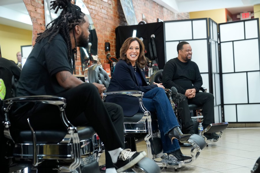 FILE - Democratic presidential nominee Vice President Kamala Harris, center, sits in conversation with Black men at Philly Cuts barbershop, Oct. 27, 2024, in Philadelphia. (AP Photo/Susan Walsh, File)