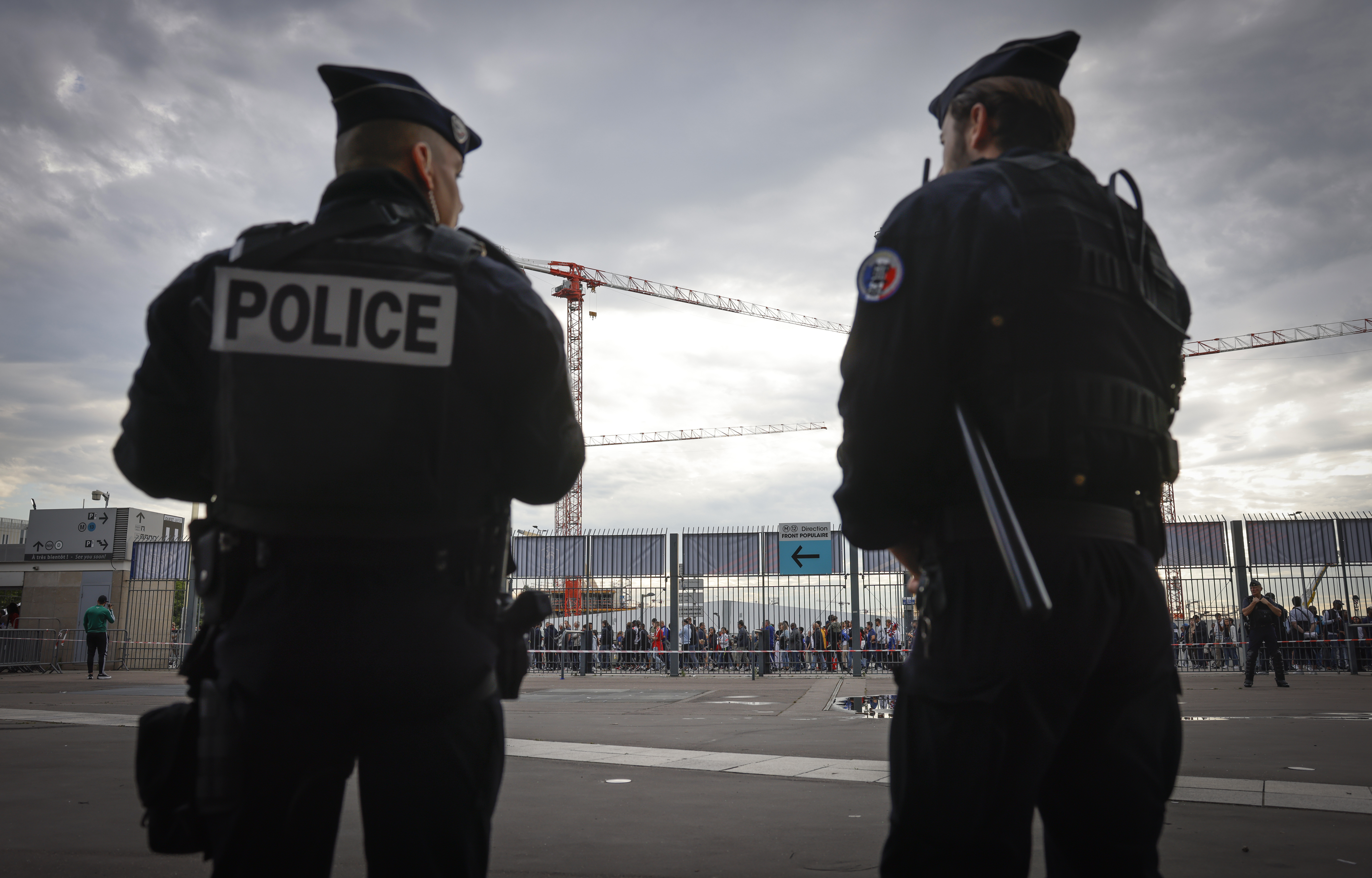 FILE - Police officers stand guard ahead the UEFA Nations League soccer match between France and Denmark at the Stade de France in Saint Denis near Paris, France, Friday, June 3, 2022. (AP Photo/Jean-Francois Badias, File)