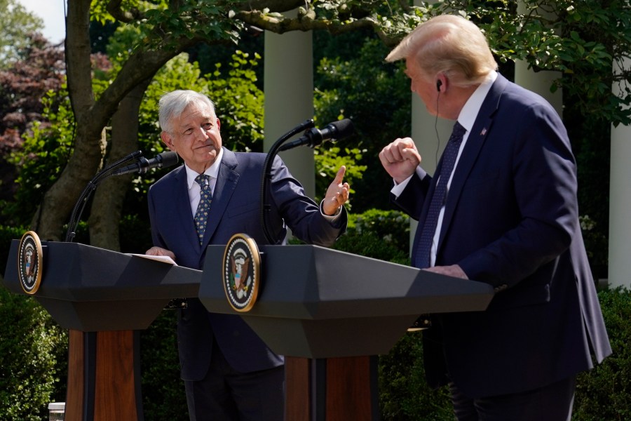 FILE - Mexico's President Andres Manuel Lopez Obrador, left, and President Donald Trump hold a joint news conference at the White House in Washington, July 8, 2020. (AP Photo/Evan Vucci, File)