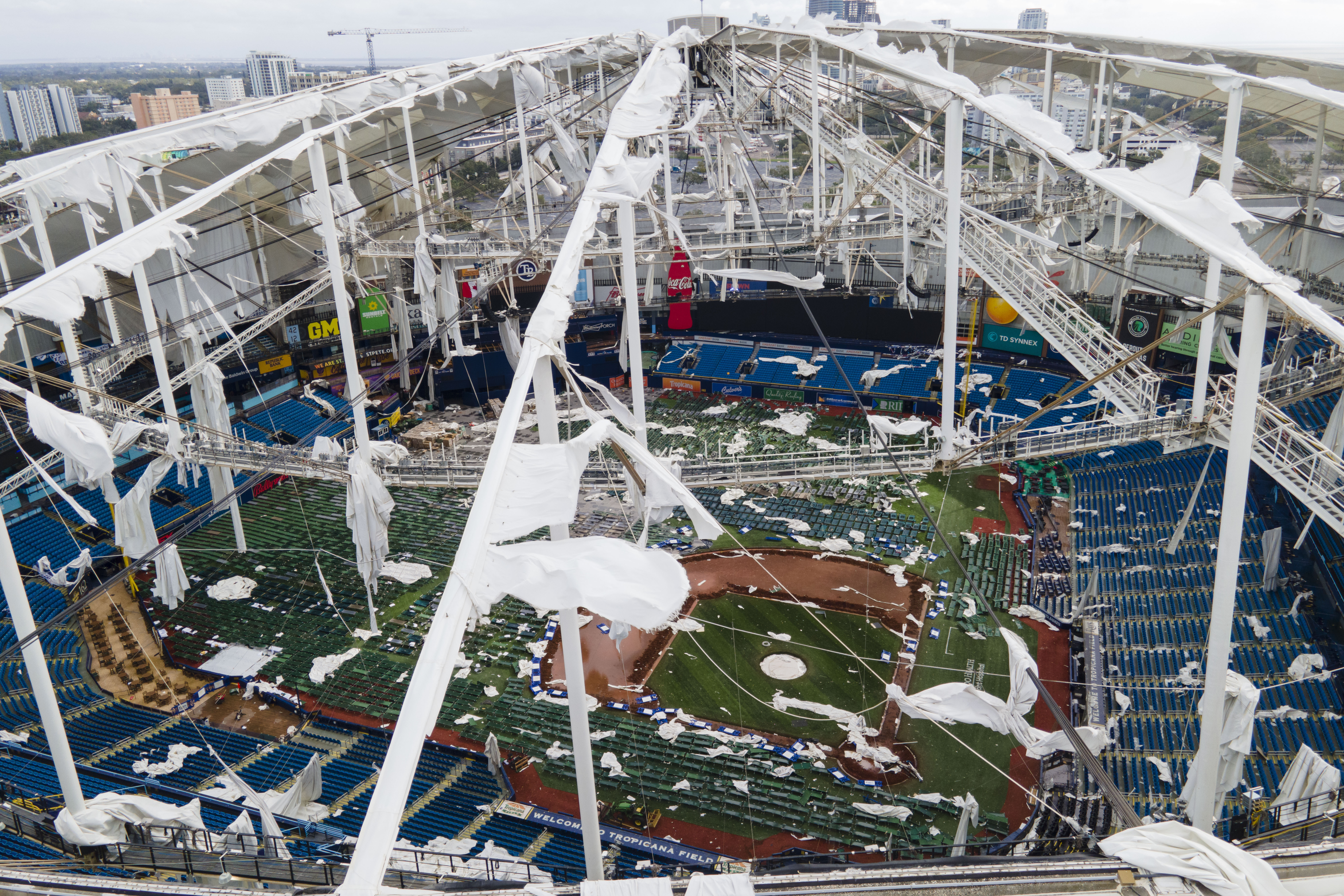 FILE - The roof of the Tropicana Field is damaged the morning after Hurricane Milton hit the region, Oct. 10, 2024, in St. Petersburg, Fla. (AP Photo/Julio Cortez, File)