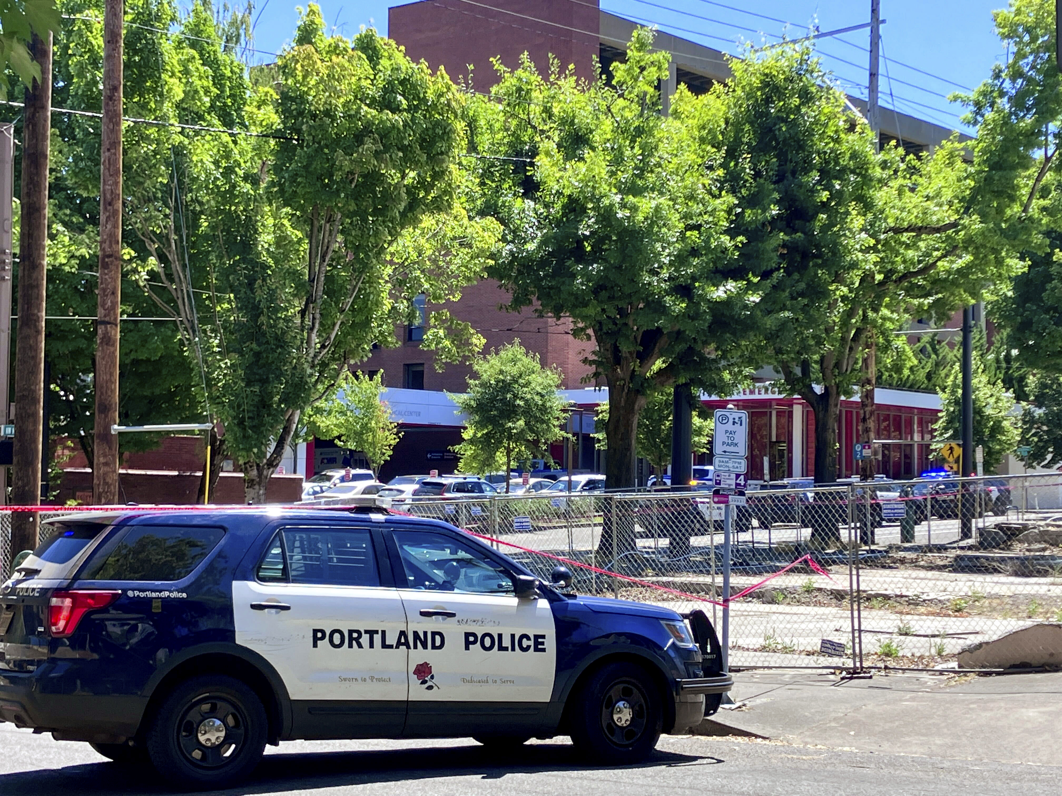 FILE - Portland Police respond to a shooting at the Legacy Good Samaritan Medical Center in Portland, Ore., July 22, 2023. (Maxine Bernstein/The Oregonian via AP, File)