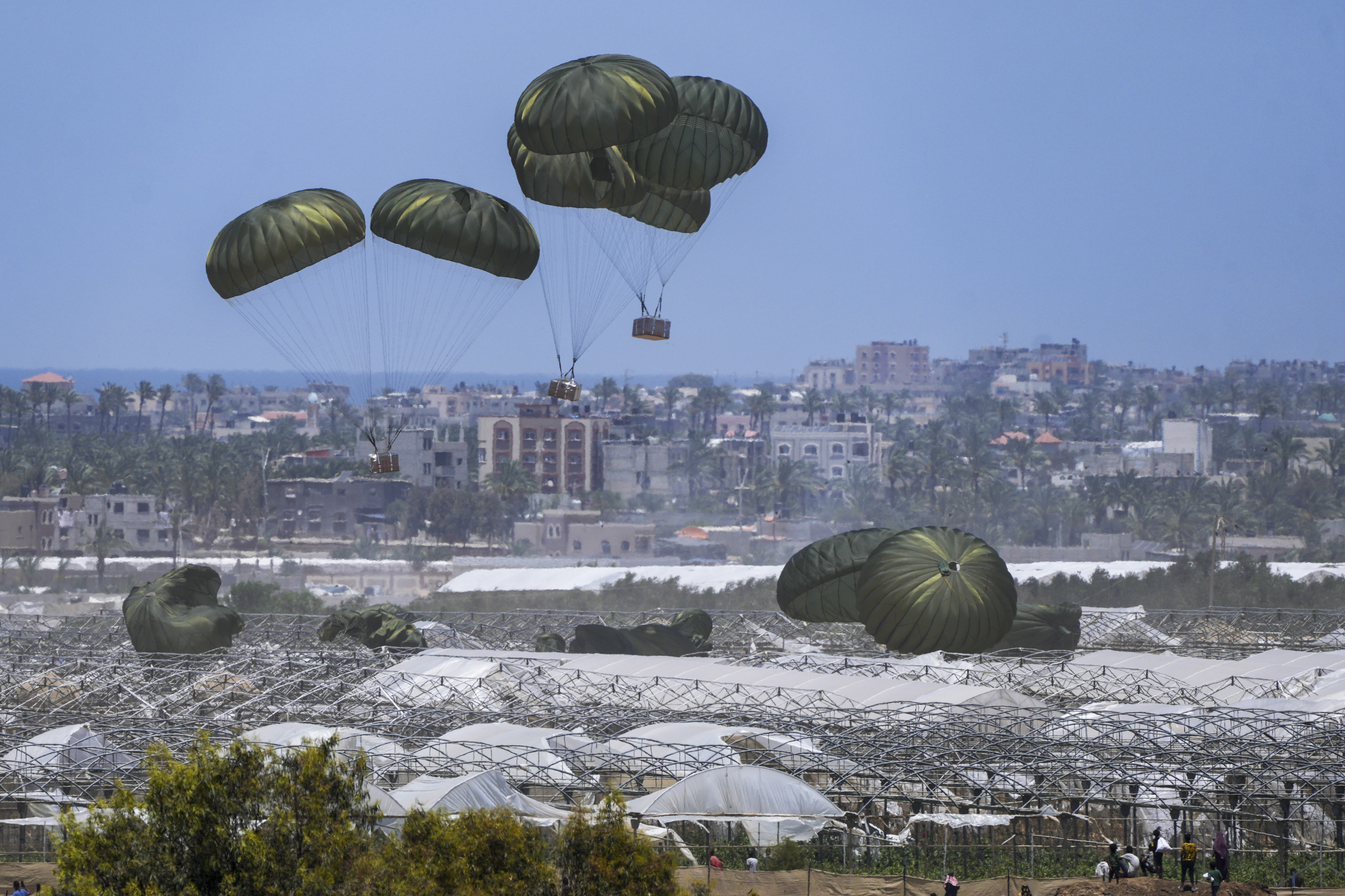 FILE - An aircraft airdrops humanitarian aid over Khan Younis, Gaza Strip, Thursday, May 30, 2024. (AP Photo/Abdel Kareem Hana, File)