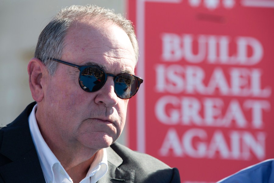 FILE - Gov. Mike Huckabee, R-Ark., takes questions from the media, prior to laying a brick at a new housing complex in the West Bank settlement of Efrat, Aug. 1, 2018. President-elect Donald Trump will nominate former Arkansas Gov. Mike Huckabee as ambassador to Israel. Trump said Tuesday that Huckabee is a staunch defender of Israel and his intended nomination comes as Trump has promised to align U.S. foreign policy more closely with Israel’s interests as it wages wars against Hamas in Gaza and Hezbollah in Lebanon.(AP Photo/Oded Balilty, File)