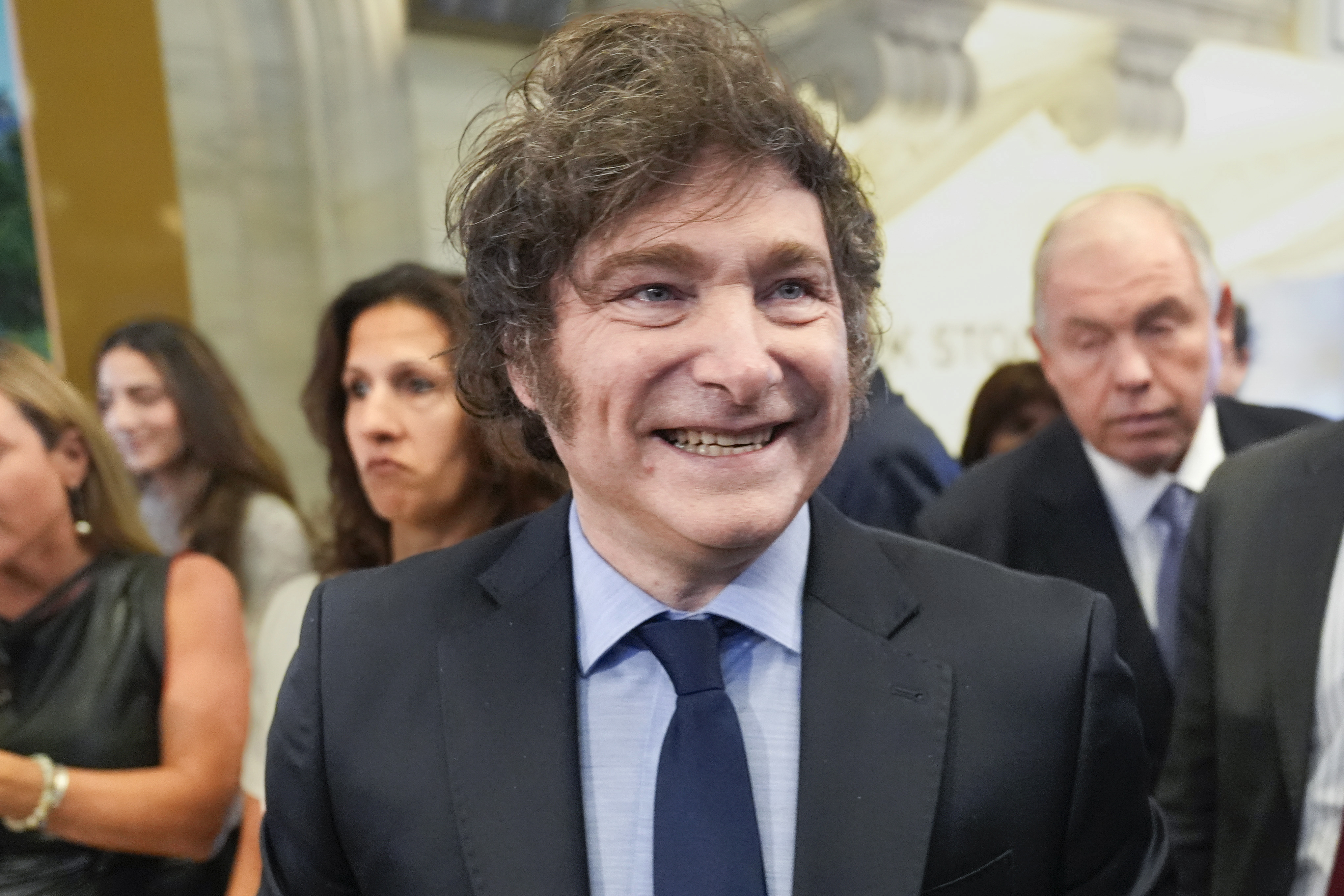 FILE - Argentina's President Javier Milei walks on the floor of the New York Stock Exchange before ringing the opening bell in New York, Sept. 23, 2024. (AP Photo/Seth Wenig, File)