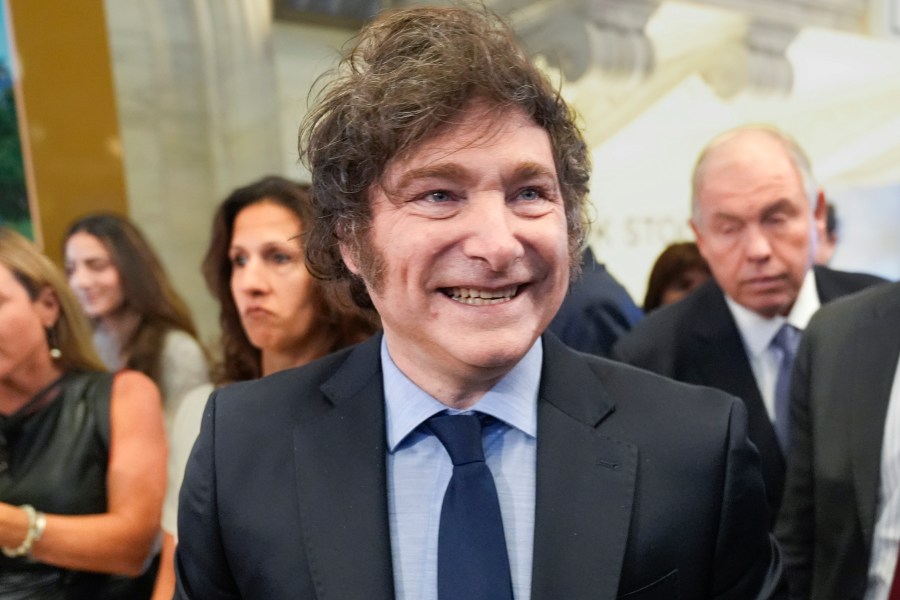 FILE - Argentina's President Javier Milei walks on the floor of the New York Stock Exchange before ringing the opening bell in New York, Sept. 23, 2024. (AP Photo/Seth Wenig, File)