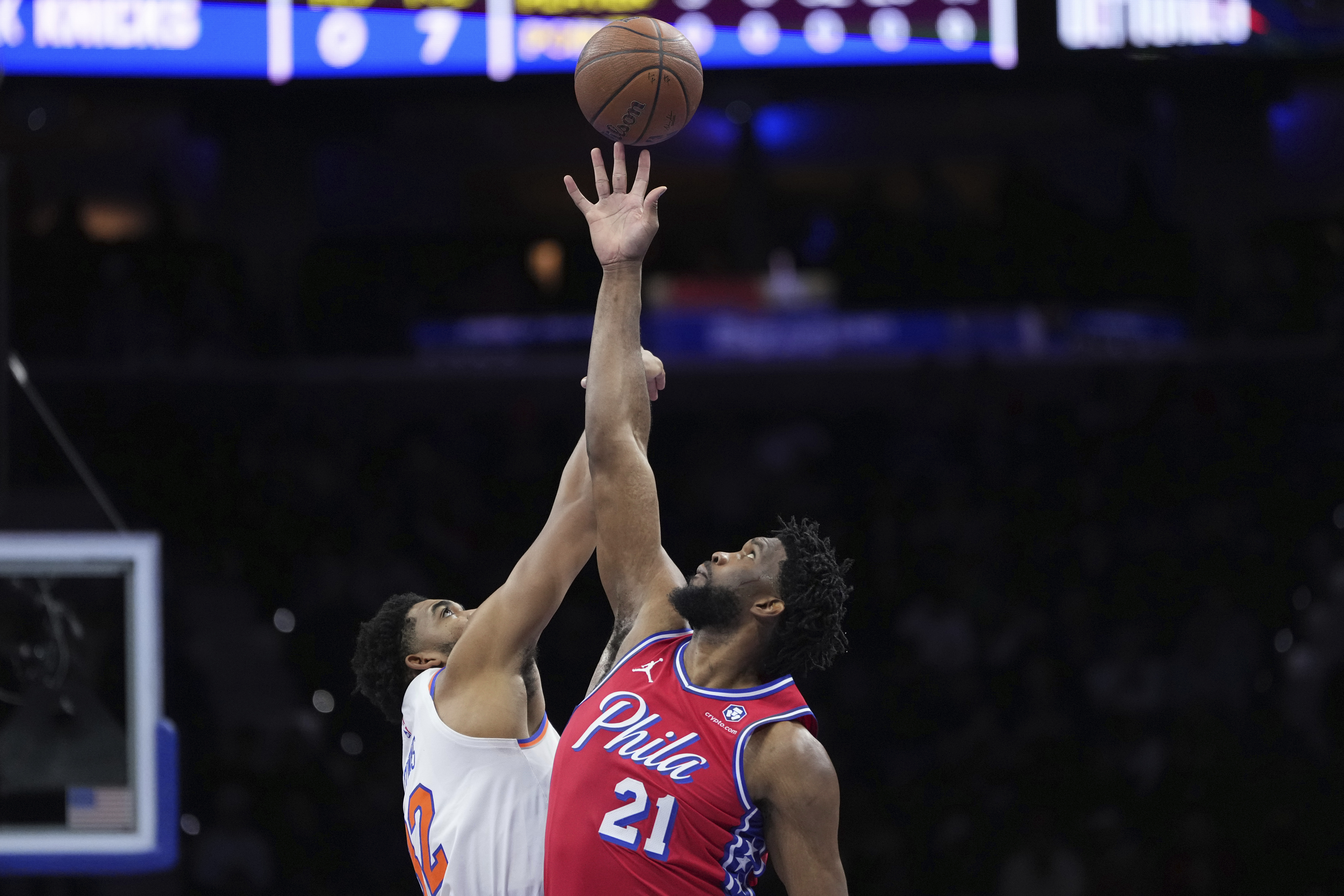 Philadelphia 76ers' Joel Embiid, right, and New York Knicks' Karl-Anthony Towns reach for the tipoff during the first half of an Emirates NBA Cup basketball game, Tuesday, Nov. 12, 2024, in Philadelphia. (AP Photo/Matt Slocum)