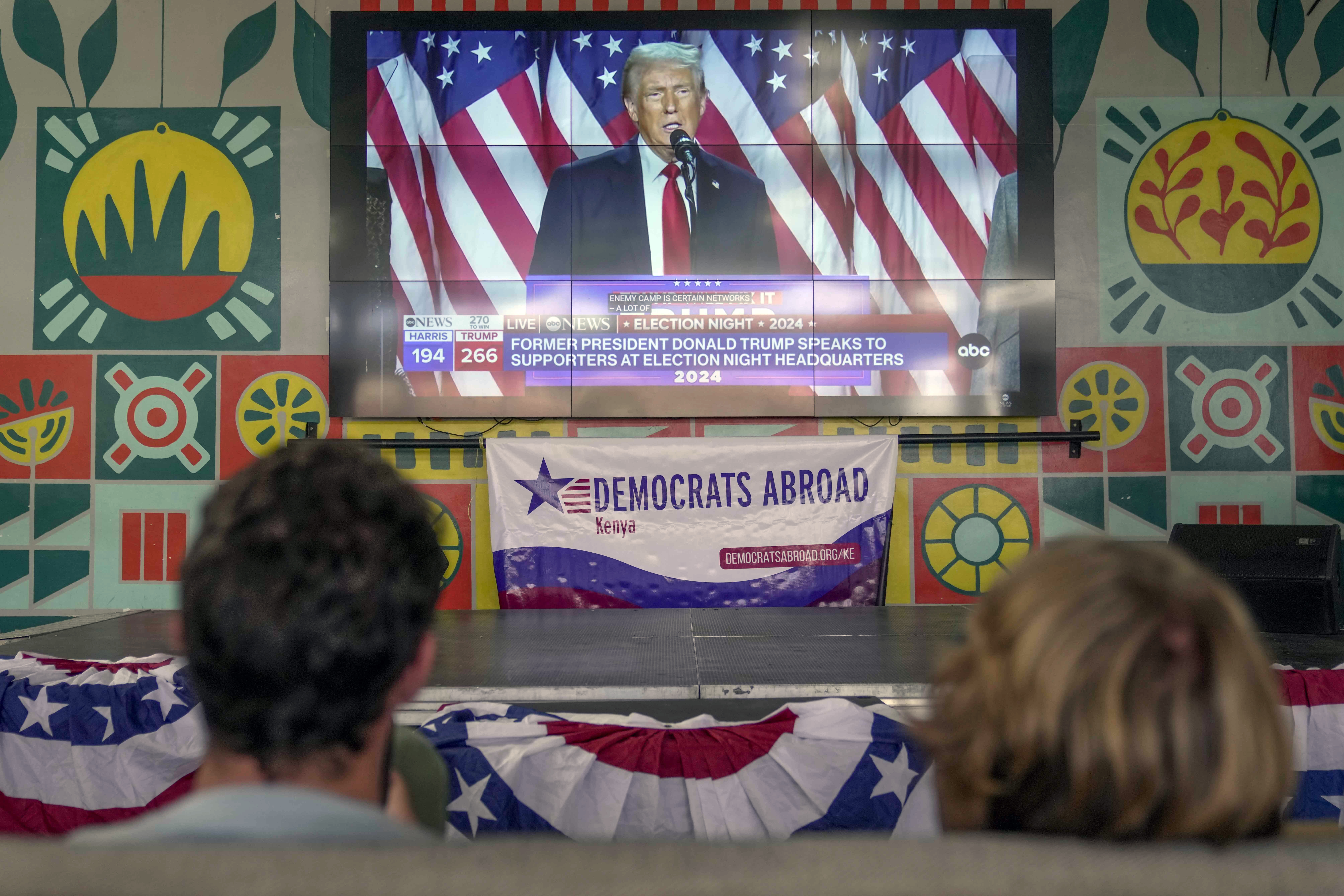 FILE- A screen shows live footage of Republican presidential nominee former President Donald Trump speech during a news program in Nairobi, Kenya, Wednesday, Nov. 6, 2024. (AP Photo/Brian Inganga, file)