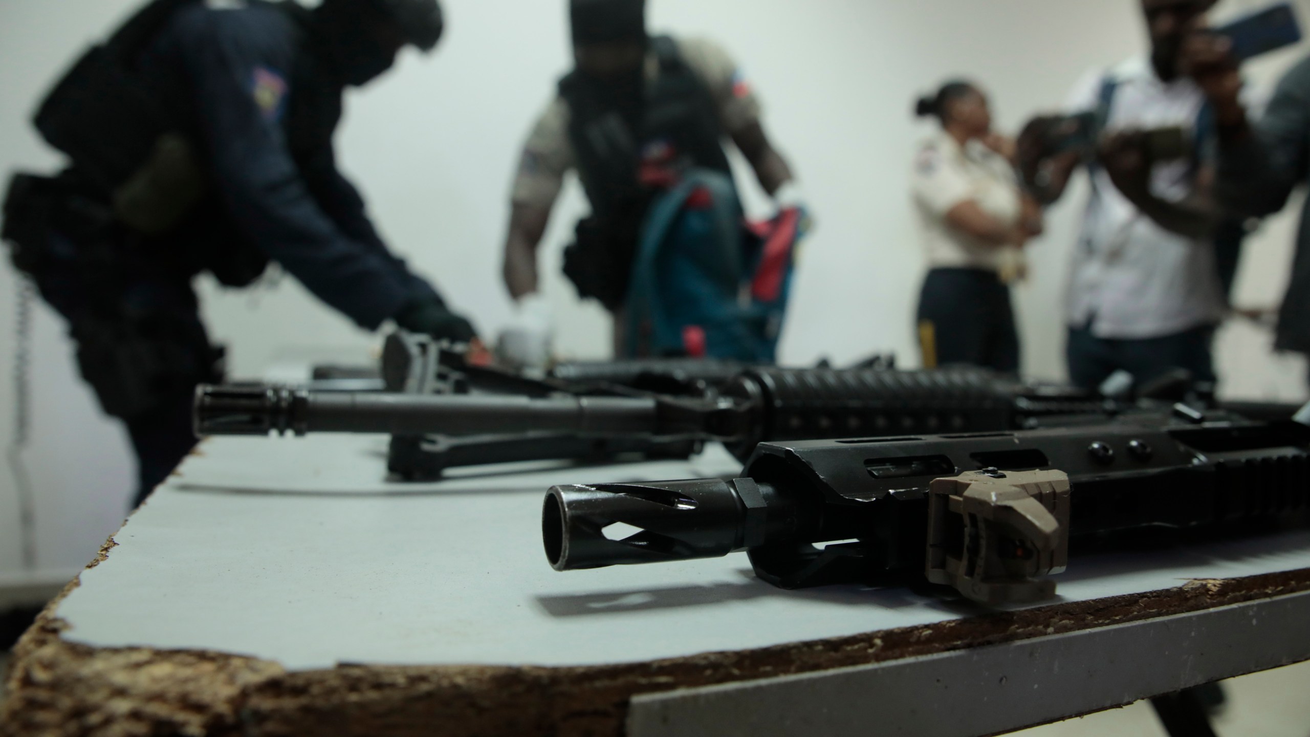 FILE - Police display weapons and equipment seized from gangs during a press conference at police headquarters in Port-au-Prince, Haiti, April 26, 2023. (AP Photo/Odelyn Joseph, File)