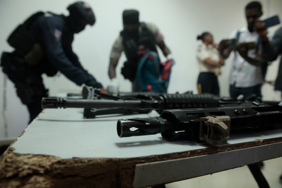 FILE - Police display weapons and equipment seized from gangs during a press conference at police headquarters in Port-au-Prince, Haiti, April 26, 2023. (AP Photo/Odelyn Joseph, File)