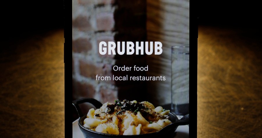 FILE - The Grubhub app is seen on an iPhone in Chicago, Feb. 20, 2018. (AP Photo/Charles Rex Arbogast, File)