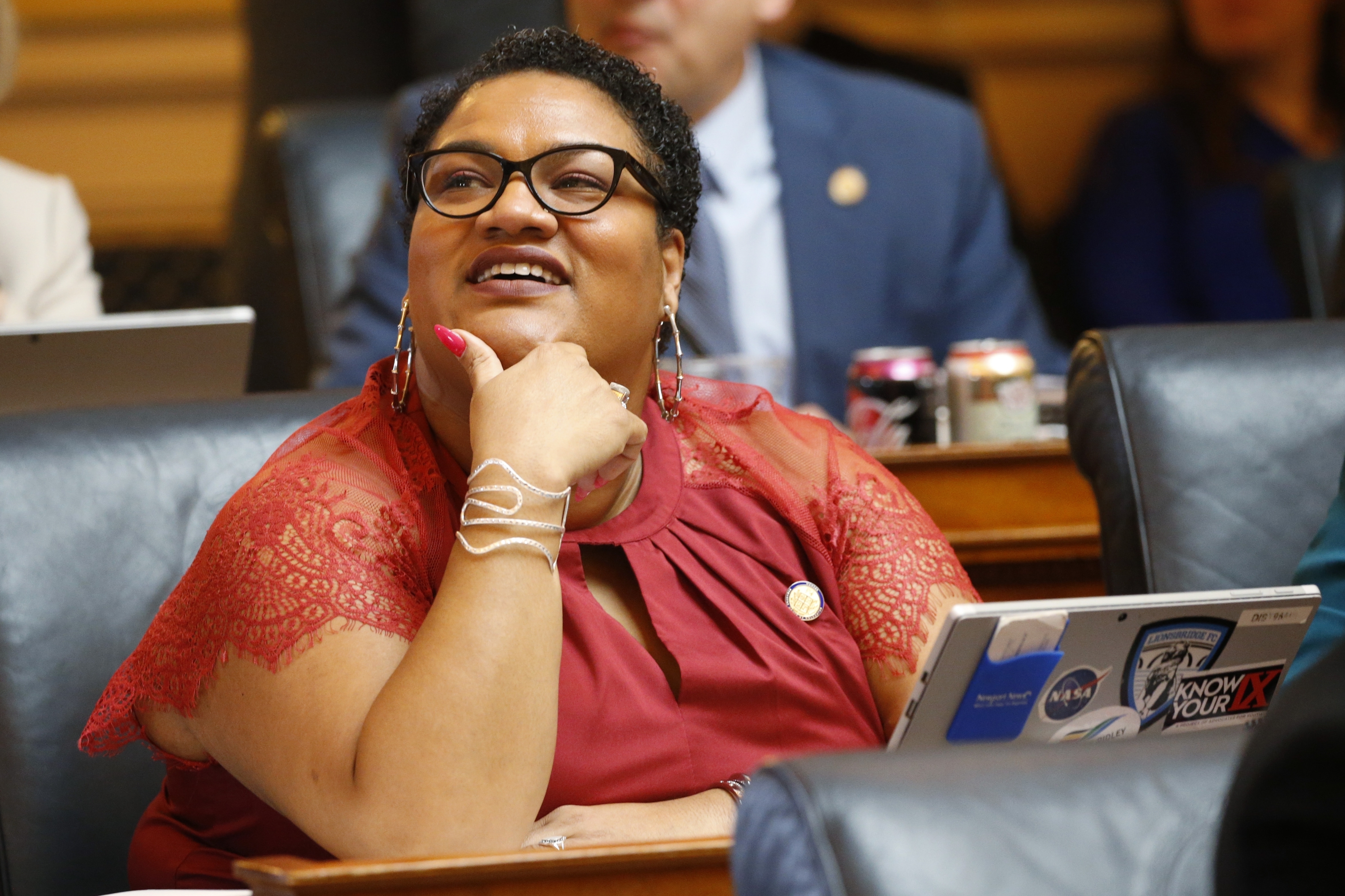 FILE - Del. Marcia 'Cia' Price, D-Newport News, looks at the vote tally board during the House session at the Capitol Wednesday, Feb. 19, 2020, in Richmond, Va. (AP Photo/Steve Helber, File)