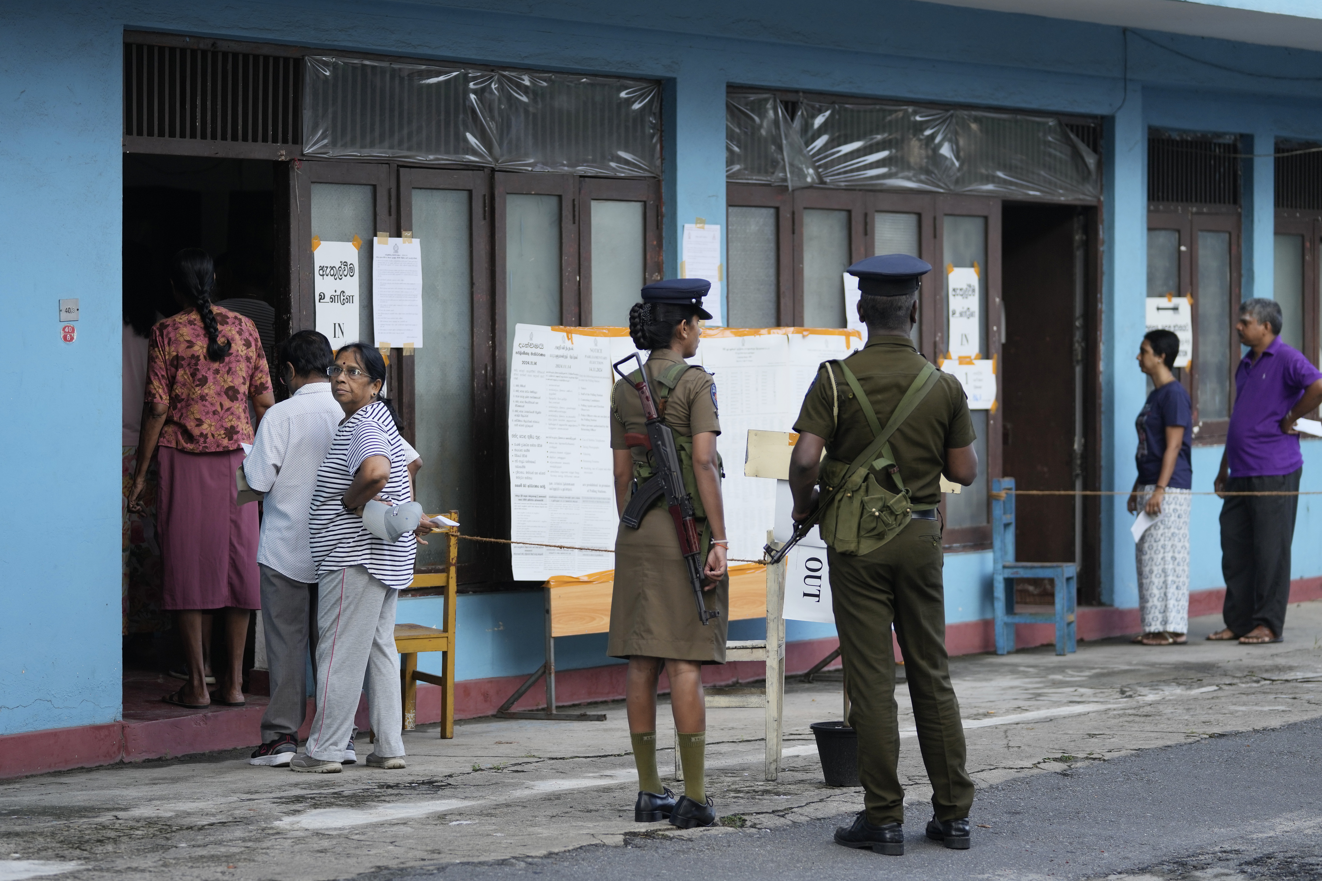 People arrive to cast their votes at a polling station during the parliamentary election in Colombo, Sri Lanka, Thursday, Nov. 14, 2024.(AP Photo/Eranga Jayawardena)