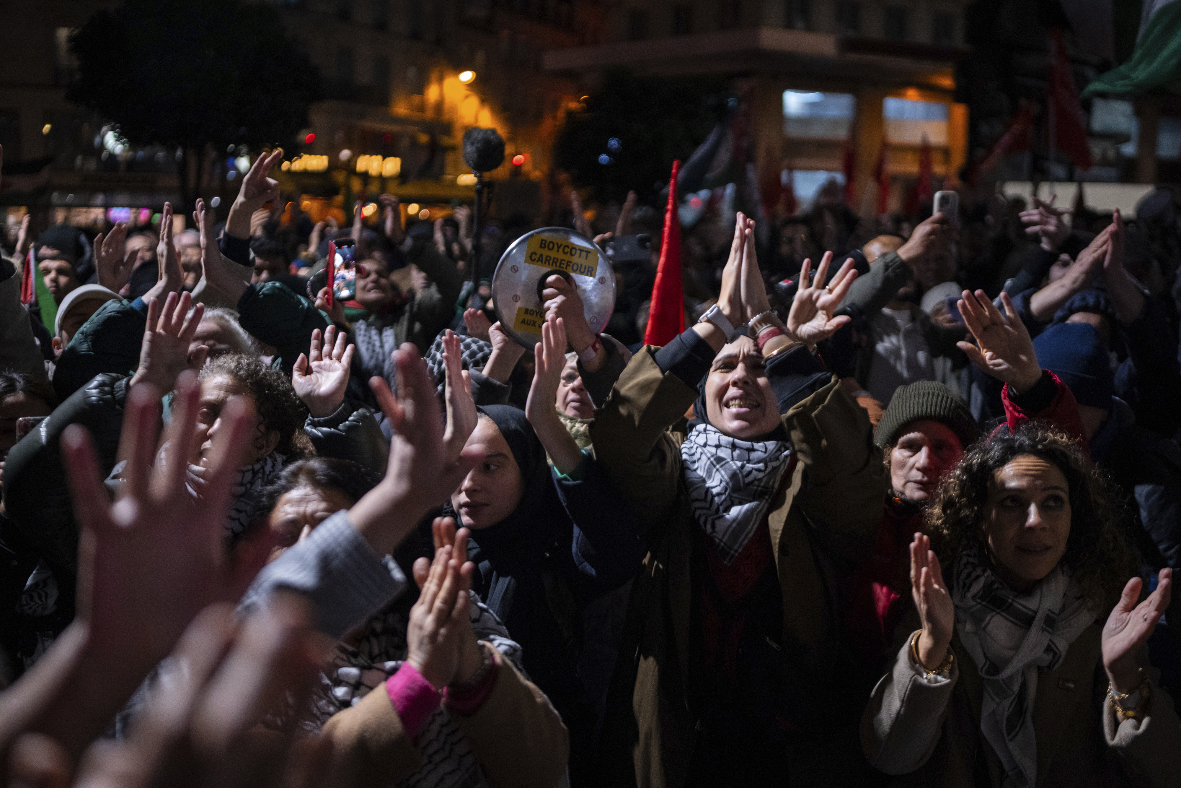 Protesters take part in a rally against the "Israel is Forever" gala organized by far-right Franco-Israeli figures, in Paris, Wednesday, Nov. 13, 2024, on the eve of the UEFA Nations League 2025 soccer match between France and Israel. (AP Photo/Louise Delmotte)