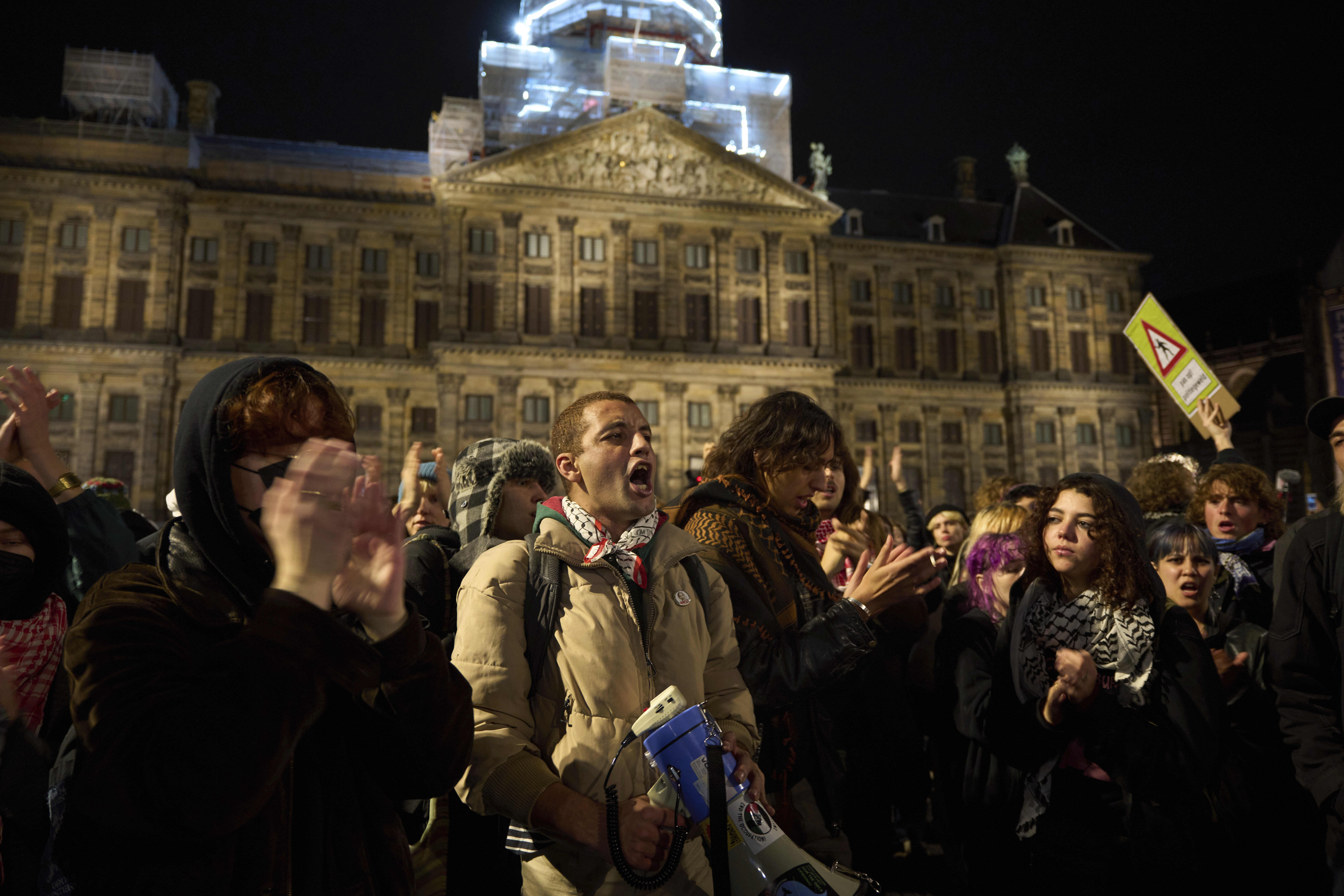 Pro-Palestinian supporters protest in Amsterdam, Netherlands, Wednesday, Nov. 13, 2024, despite a city ban on such gatherings. (AP Photo/Bram Janssen)