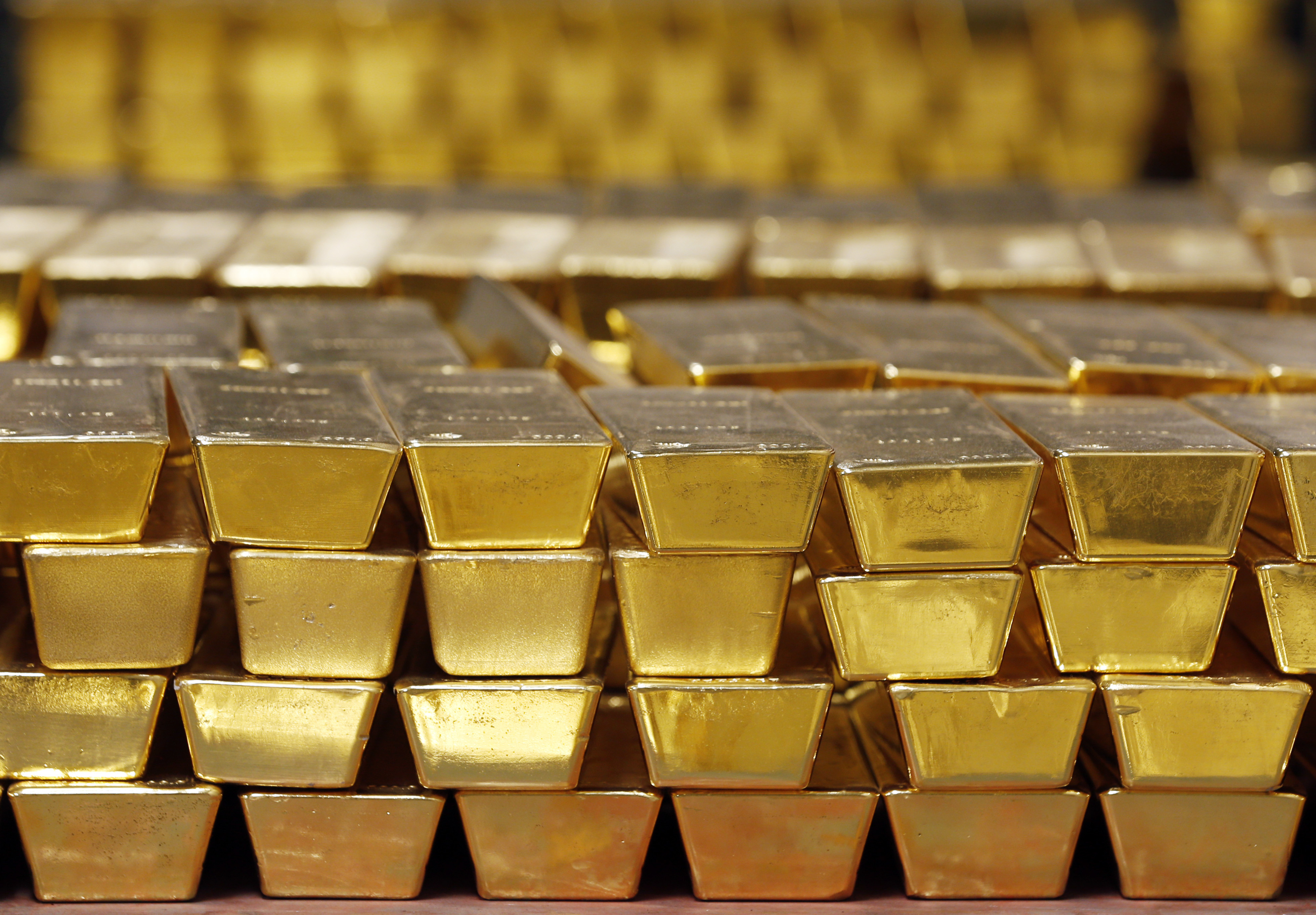 FILE - Gold bars are shown stacked in a vault at the United States Mint on July 22, 2014 in West Point, N.Y. (AP Photo/Mike Groll, File)