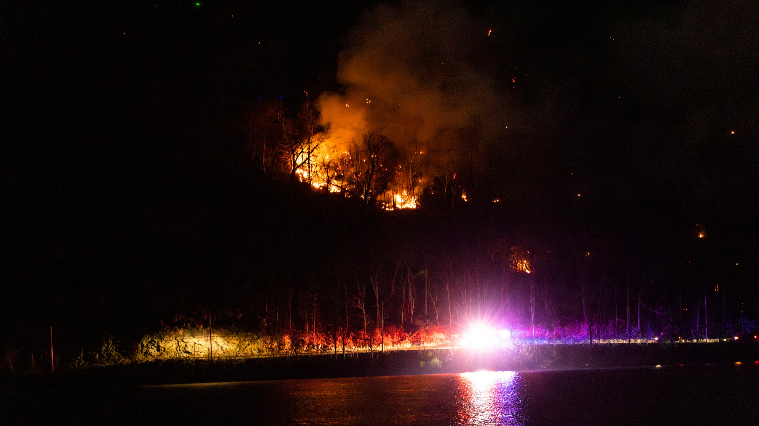 Wildfires burn along the New York and New Jersey border in Greenwood Lake, New York, Wednesday, Nov. 13, 2024. (AP Photo/Eduardo Munoz Alvarez)