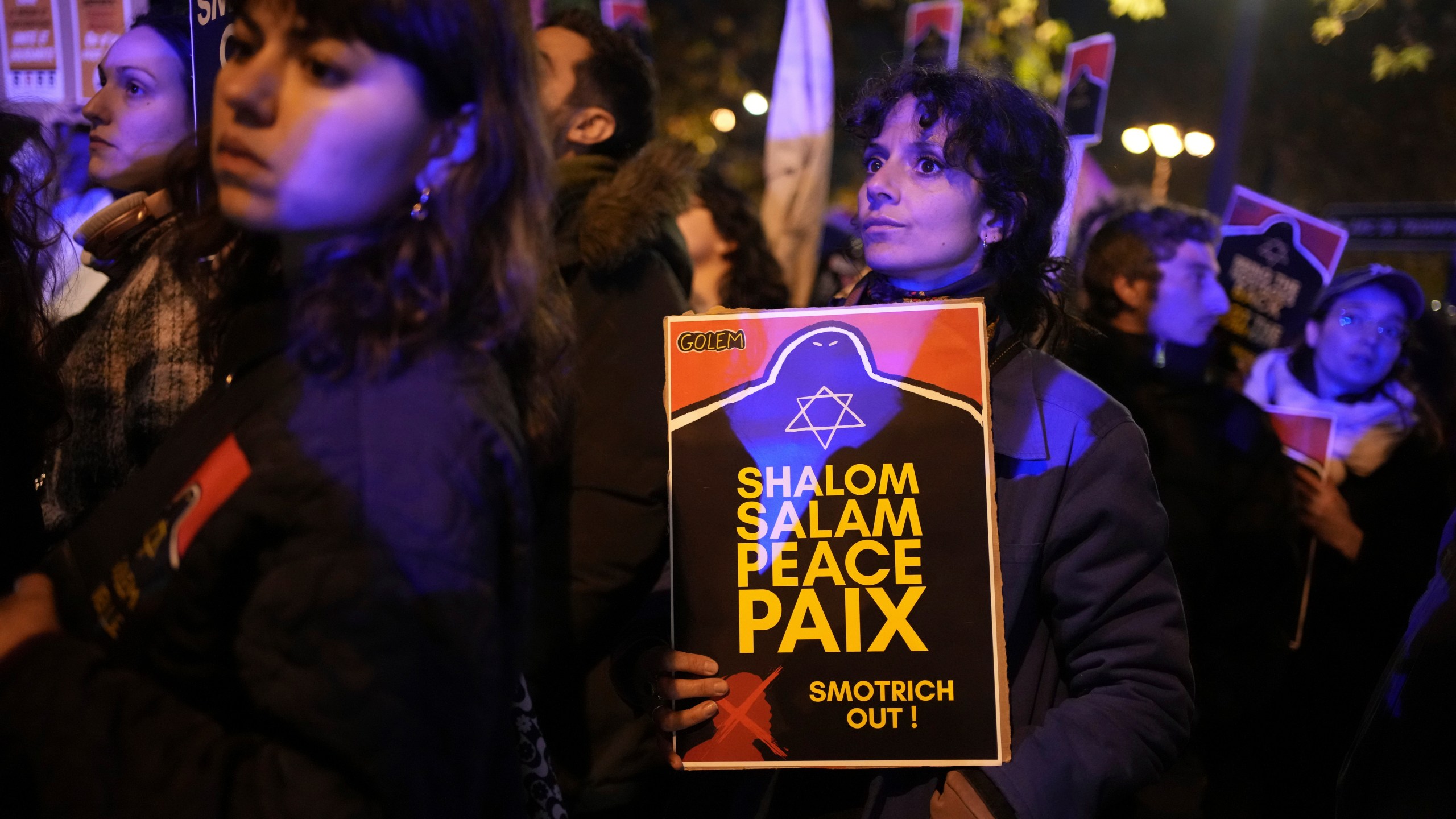 Protesters take part in a rally against the "Israel is Forever" gala organized by far-right Franco-Israeli figures, in Paris, Wednesday, Nov. 13, 2024, on the eve of the UEFA Nations League 2025 soccer match between France and Israel. (AP Photo/Christophe Ena)