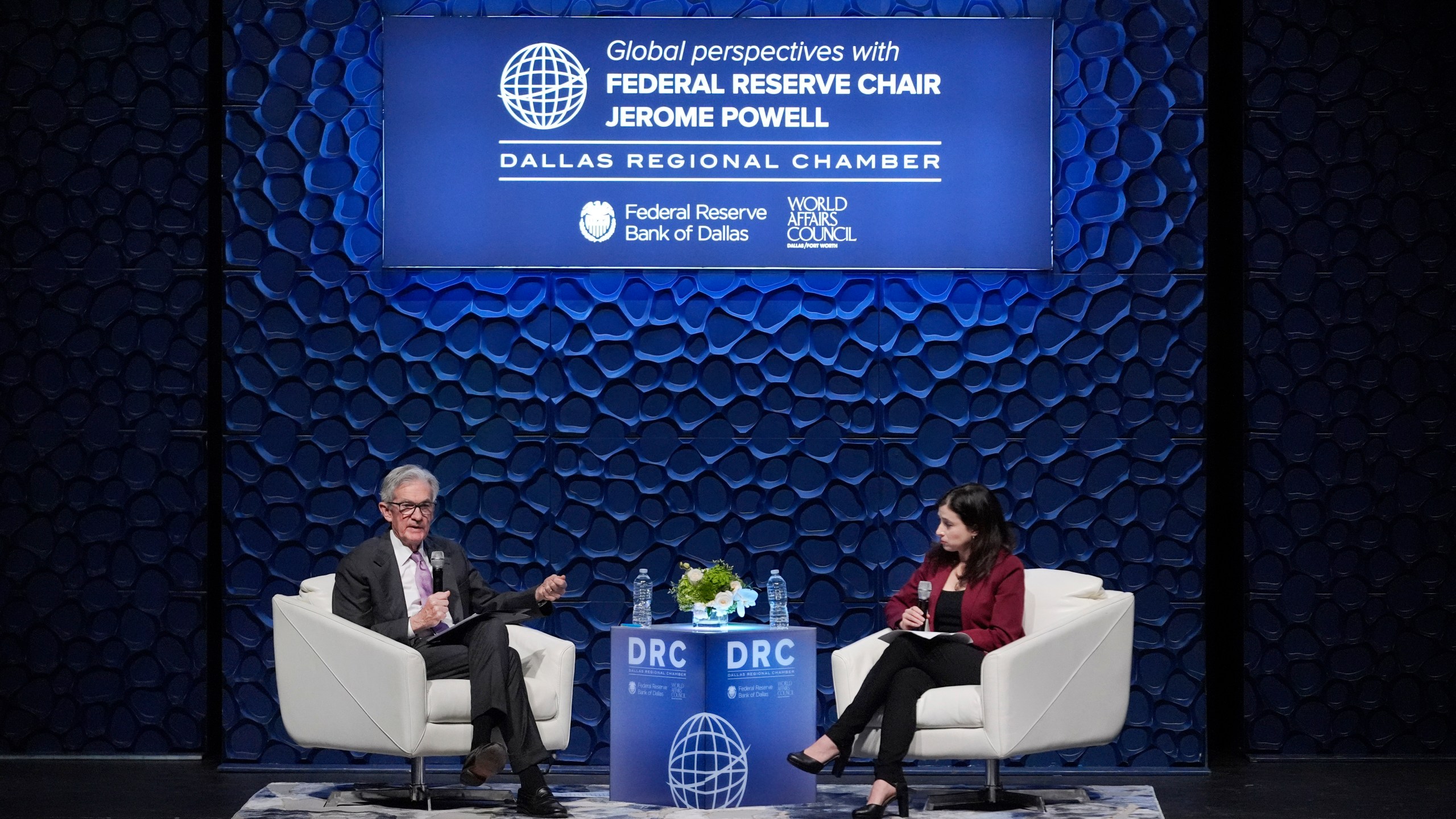 Federal Reserve Chair Jerome Powell, left, speaks to the Dallas Regional Chamber as moderator Catherine Rampell looks during an event in Music Hall at Fair Park Thursday, Nov. 14, 2024, in Dallas. (AP Photo/LM Otero)