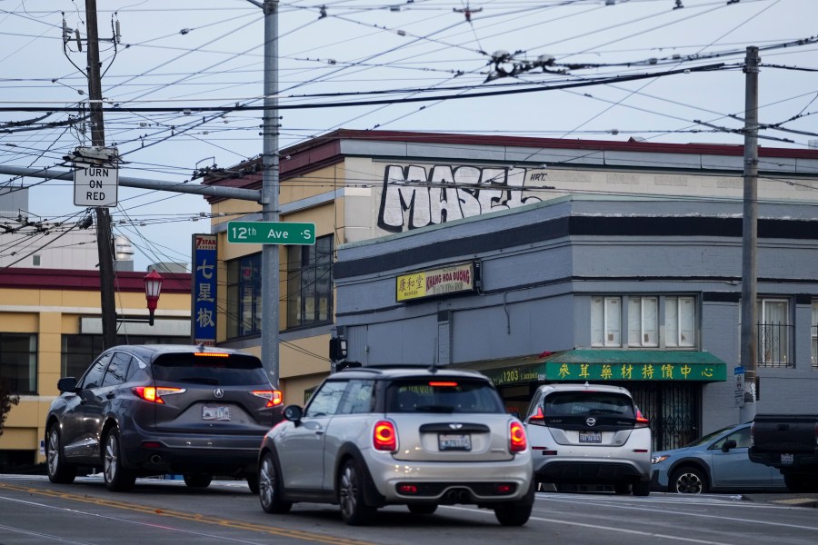 Drivers move through the area where multiple people were stabbed earlier Friday, Nov. 8, 2024, in the Chinatown-International District in Seattle. (AP Photo/Lindsey Wasson)