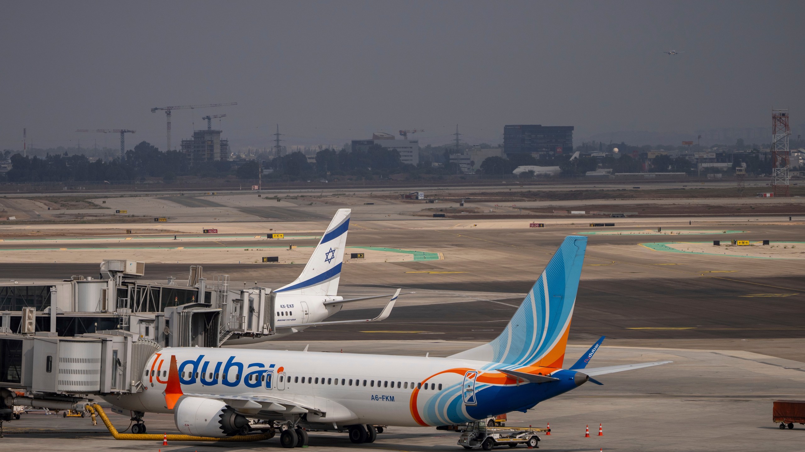 A Fly Dubai plane is parked on the tarmac at Ben Gurion International Airport near Lod, Israel, Sunday, Nov. 10, 2024. (AP Photo/Ohad Zwigenberg)