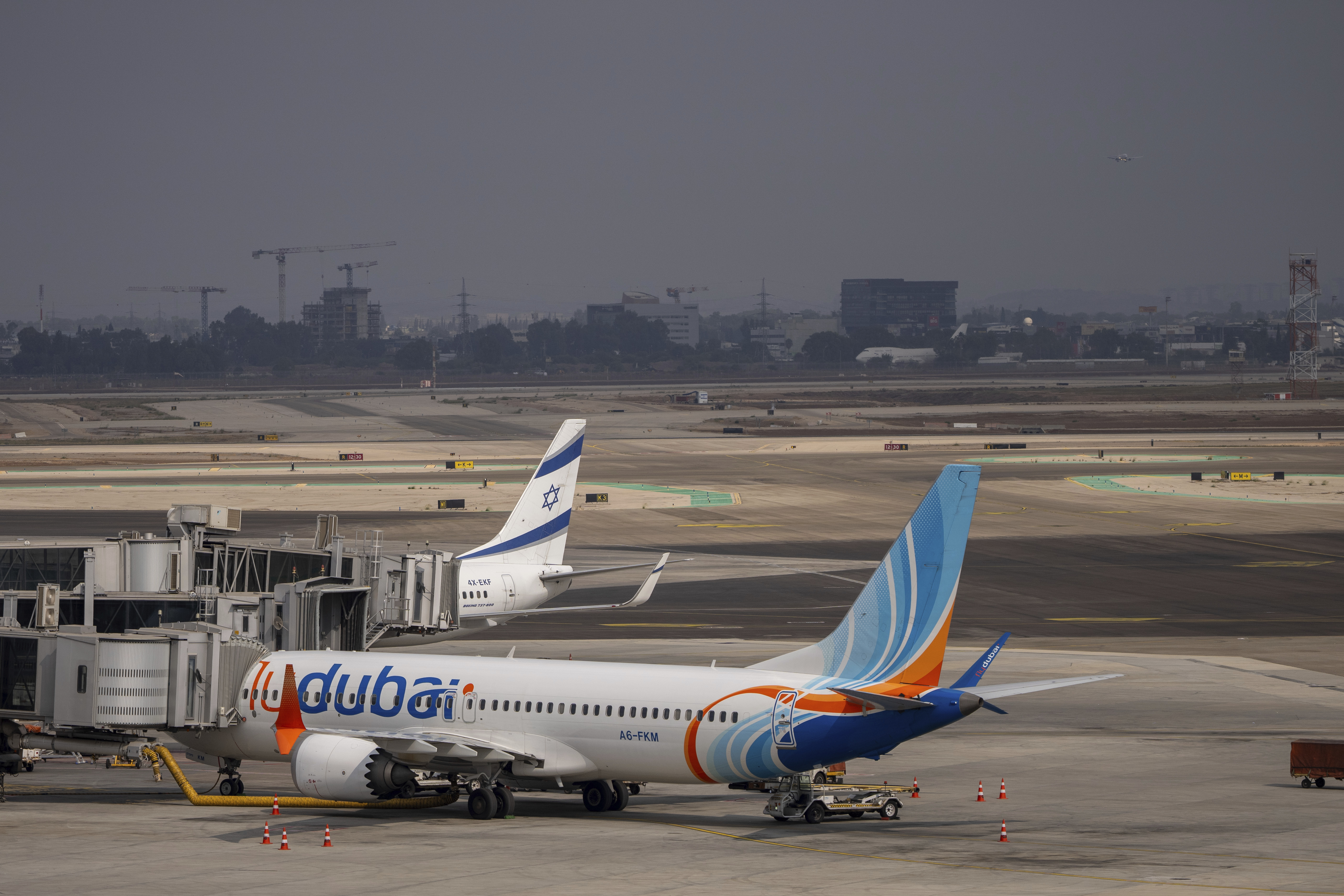 A Fly Dubai plane is parked on the tarmac at Ben Gurion International Airport near Lod, Israel, Sunday, Nov. 10, 2024. (AP Photo/Ohad Zwigenberg)