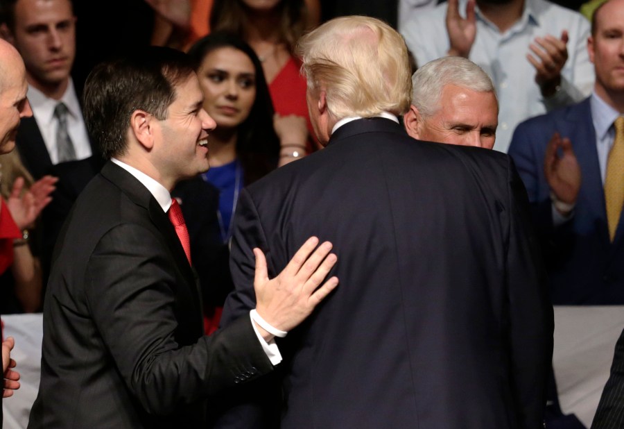 FILE - Sen. Marco Rubio, R-Fla., walks off the stage with President Donald Trump after a speech where Trump revised a Cuba policy, in Miami, June 16, 2017. (AP Photo/Lynne Sladky, File)