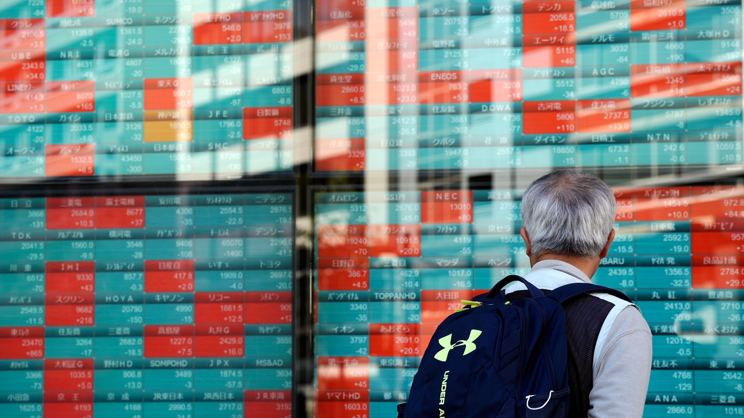 FILE - A person looks at an electronic stock board showing Japan's Nikkei index at a securities firm Wednesday, Nov. 13, 2024, in Tokyo. (AP Photo/Eugene Hoshiko, File)