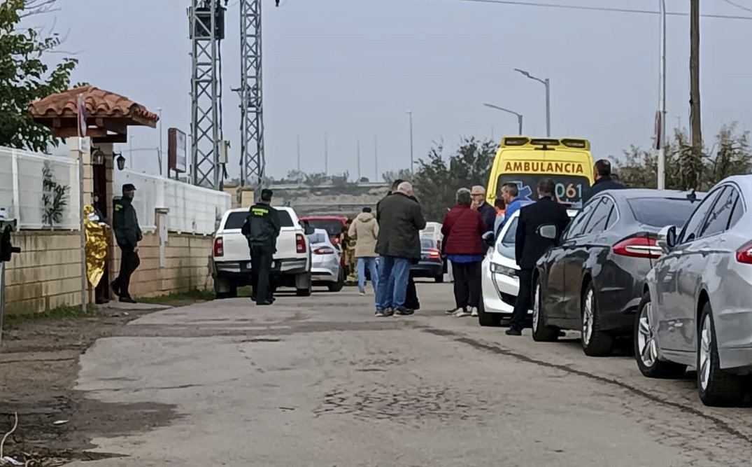 Relatives waiting for news outside the nursing home where least 10 people have died in a fire in Zaragoza, Spain, Friday, Nov. 15, 2024. (AP Photo/Ferran Mallol )