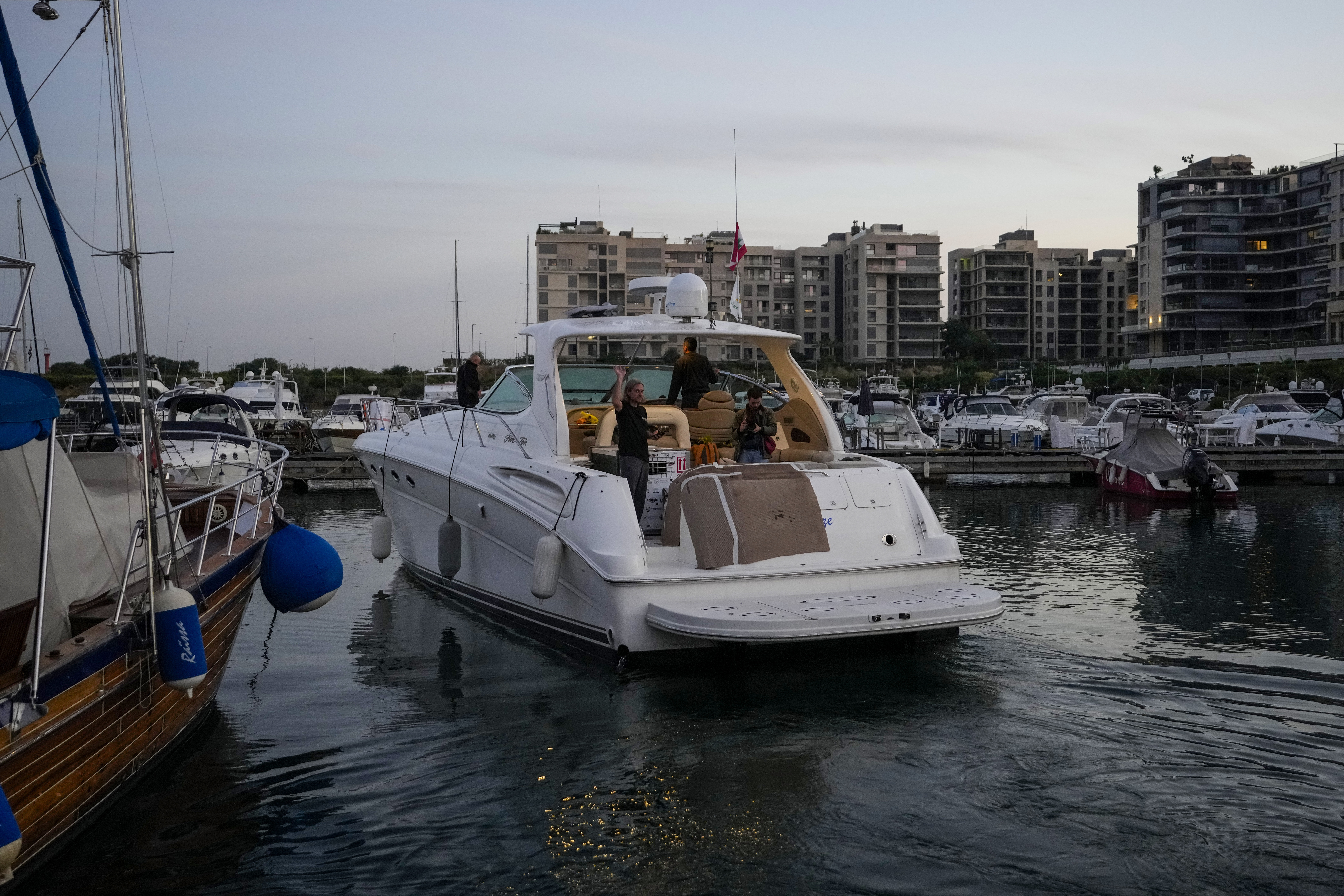 A yacht carrying Sara the lion cub leaves at the Dbayeh sea port, north of Beirut, Lebanon, Thursday, Nov. 14, 2024. (AP Photo/Hassan Ammar)